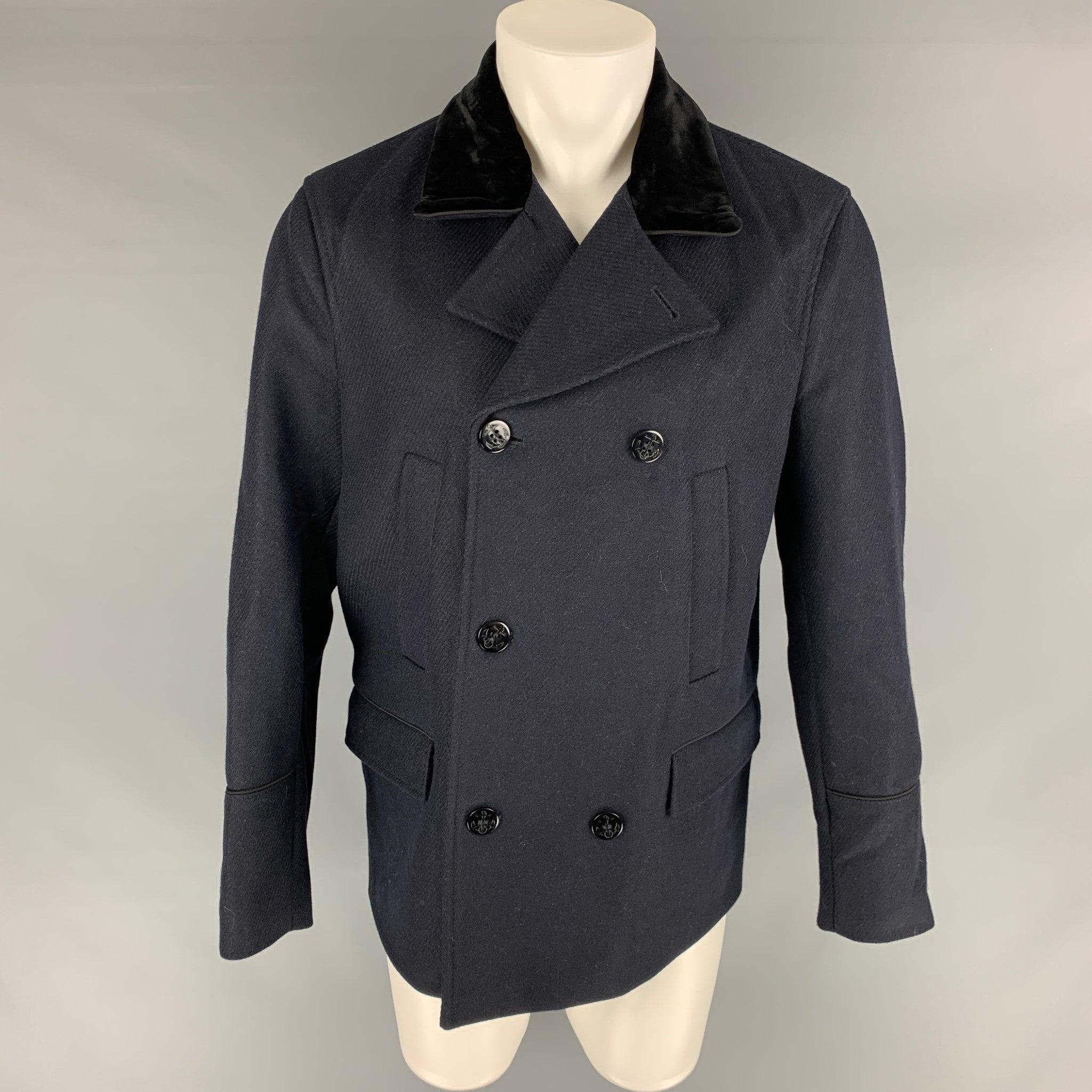 THE KOOPLES pea coat comes in a black wool blend, featuring a velvet collar, and welt side pockets.Excellent Pre-Owned Condition. 

Marked:  50 

Measurements: 
 
Shoulder: 19 inches Chest: 40 inches Sleeve: 25 inches Length: 31 inches 
 Reference: