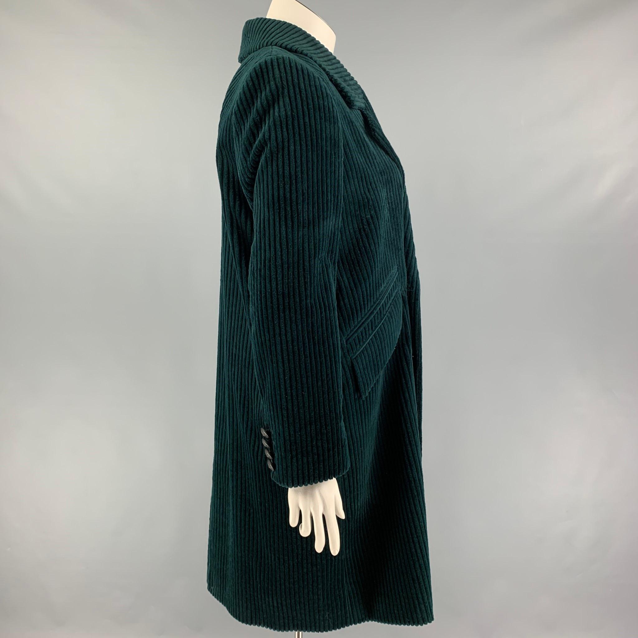 THE KOOPLES coat comes in forest green corduroy cotton with a full liner featuring a notch lapel, flap pockets, and a double breasted closure. 

New with tags. 
Marked: 40
Original Retail Price: $645.00

Measurements:

Shoulder: 16.5 in.
Bust: 42