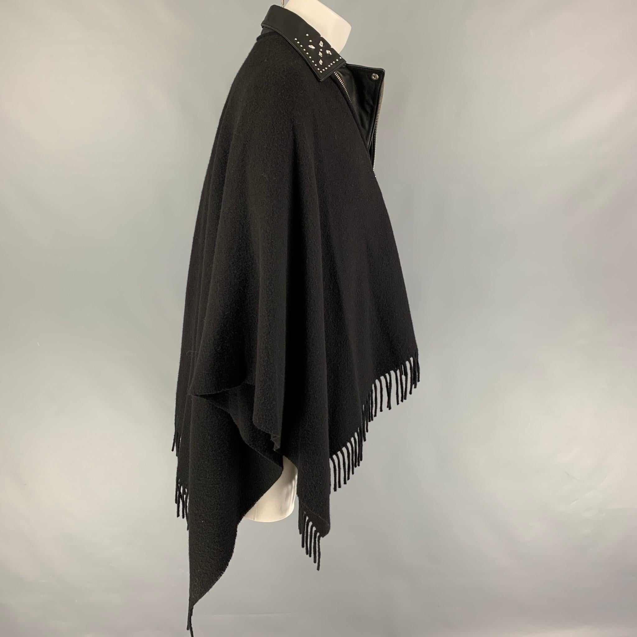 THE KOOPLES coat comes in a black wool featuring a leather trim, studded collar design, fringe trim, and a zip up closure. 

Very Good Pre-Owned Condition.
Marked: One Size

Measurements:

Length: 33.5 in. 