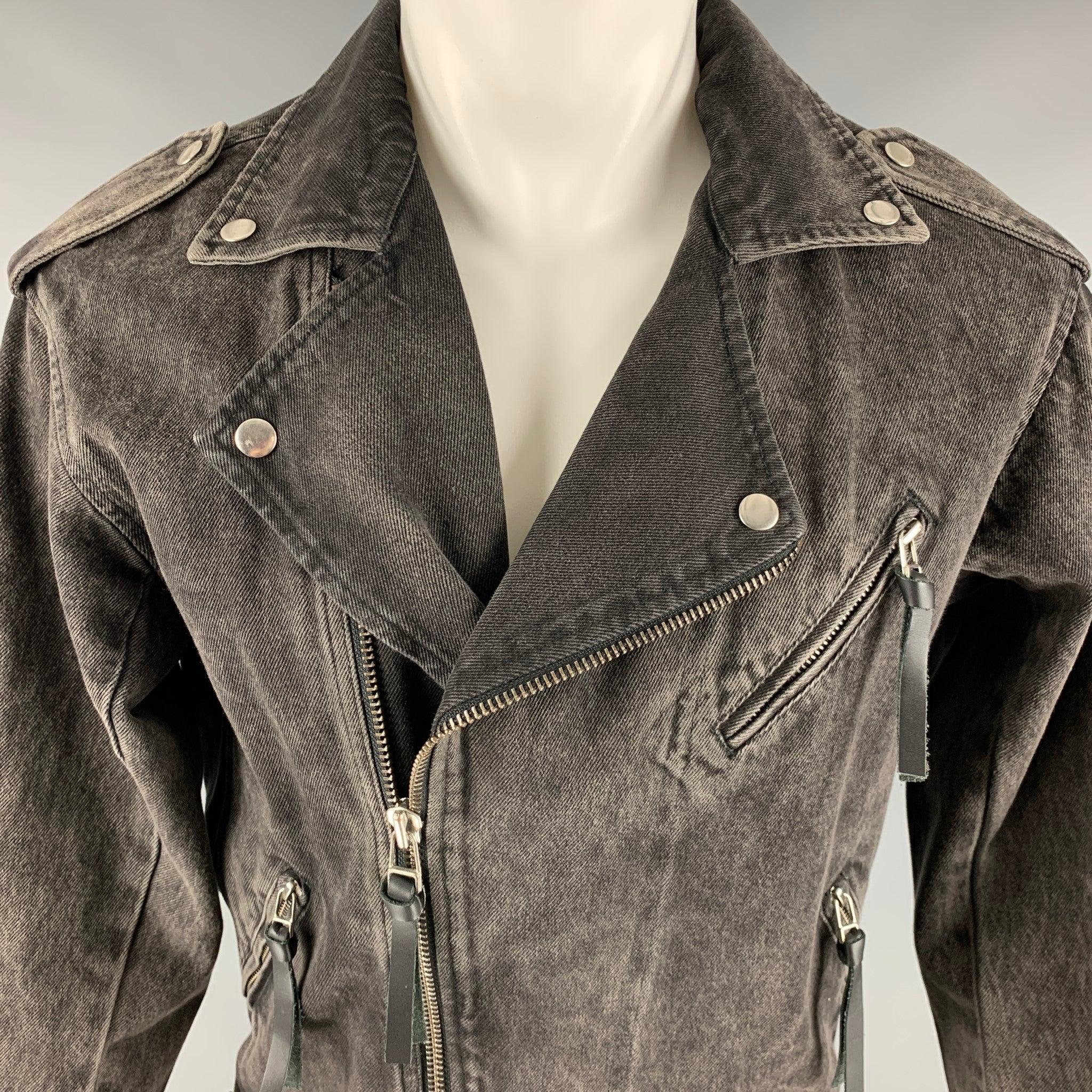 THE KOOPLES jacket
in a black denim featuring beaded back design, biker style, leather zipper pulls, and zip up closure.Very Good Pre-Owned Condition. Missing some crystal embellishments on back. 

Marked:   1 

Measurements: 
 
Shoulder: 17.5