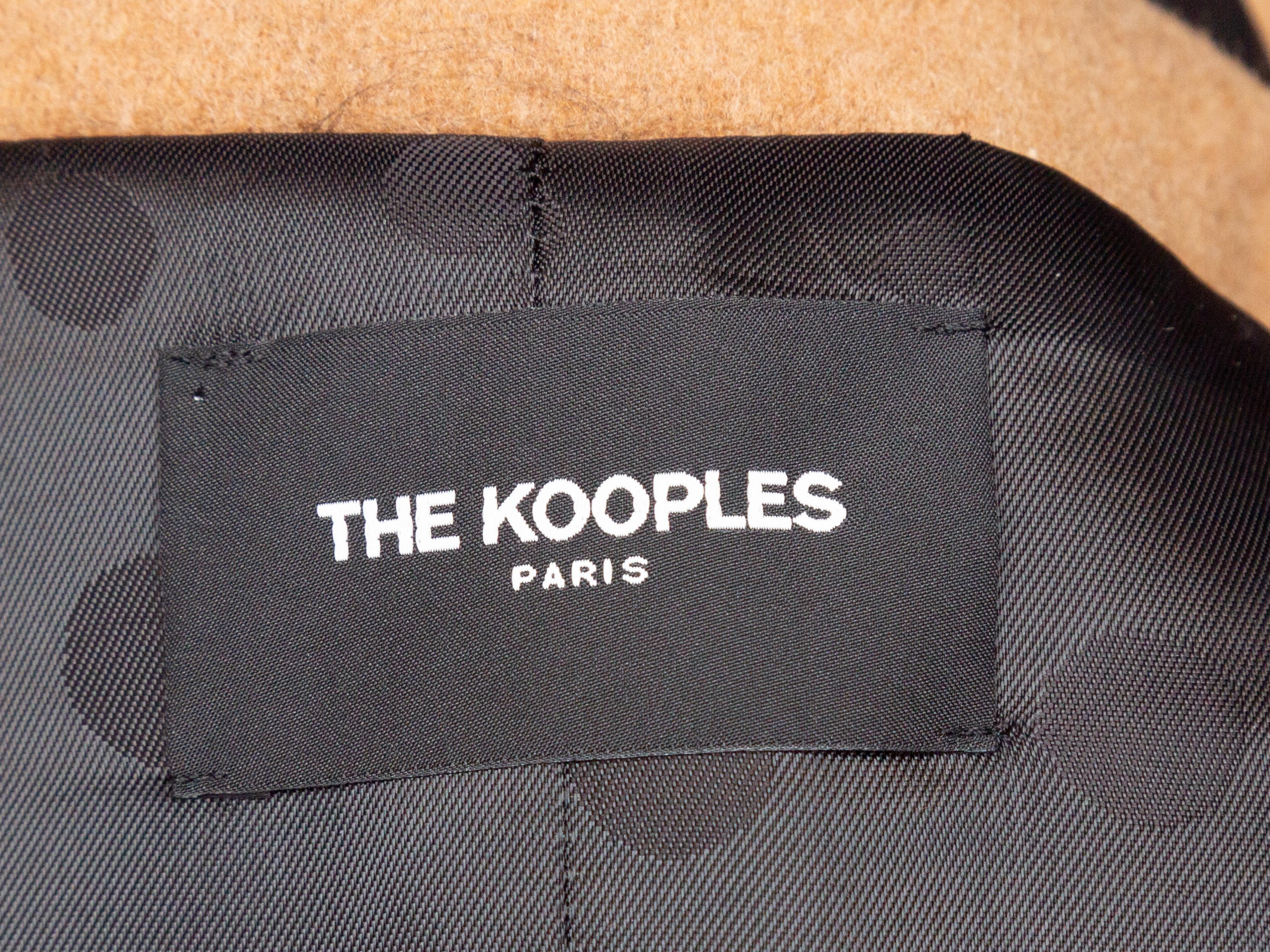 Product details: Tan and black wool and leather long trench coat by The Kooples. Notched lapel. Dual hip pockets. Belt at waist. Button closures at front. Designer size 36. 44