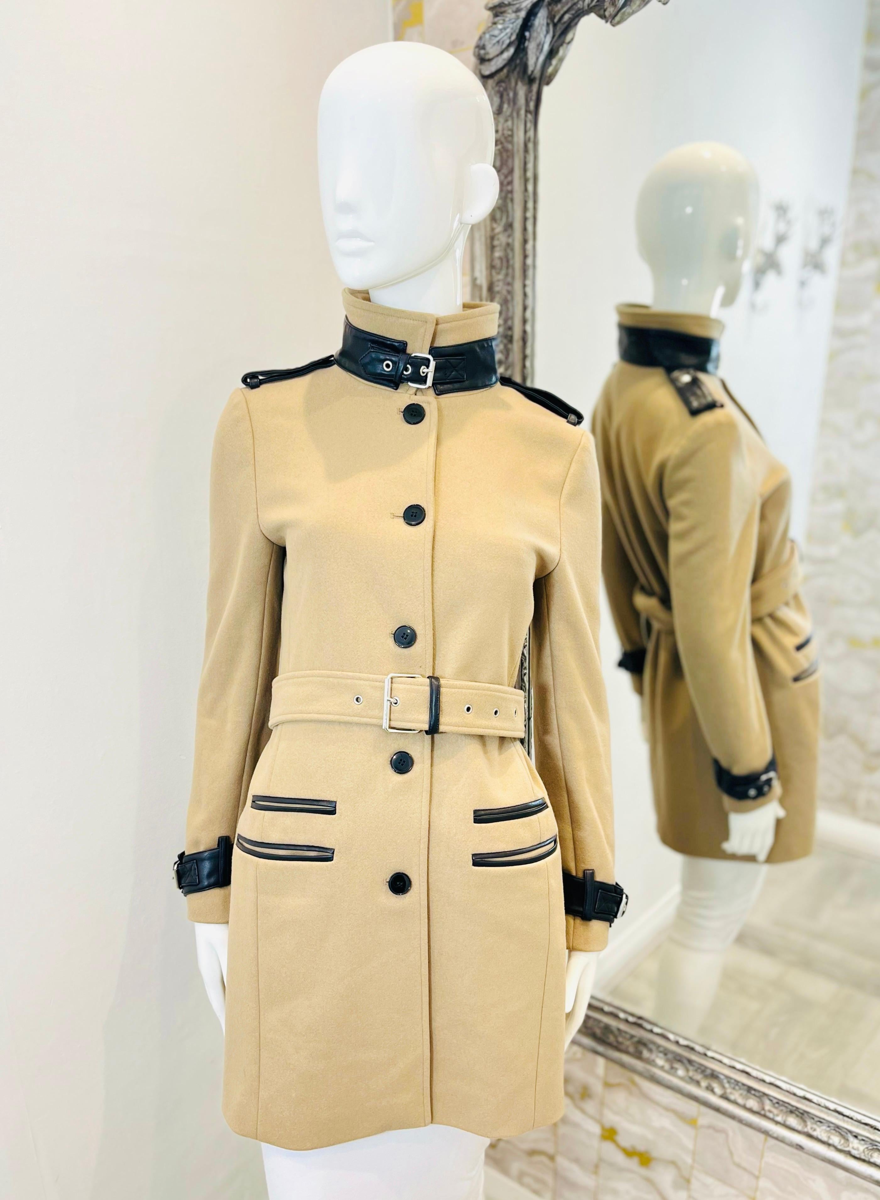 The Kooples Wool & Cashmere Coat With Leather Trim

Beige, single-breasted coat designed with dark brown leather trims.

Detailed with popper-fastened shoulder epaulettes and buckled straps at cuffs.

Styled with belted waist, welt pockets and