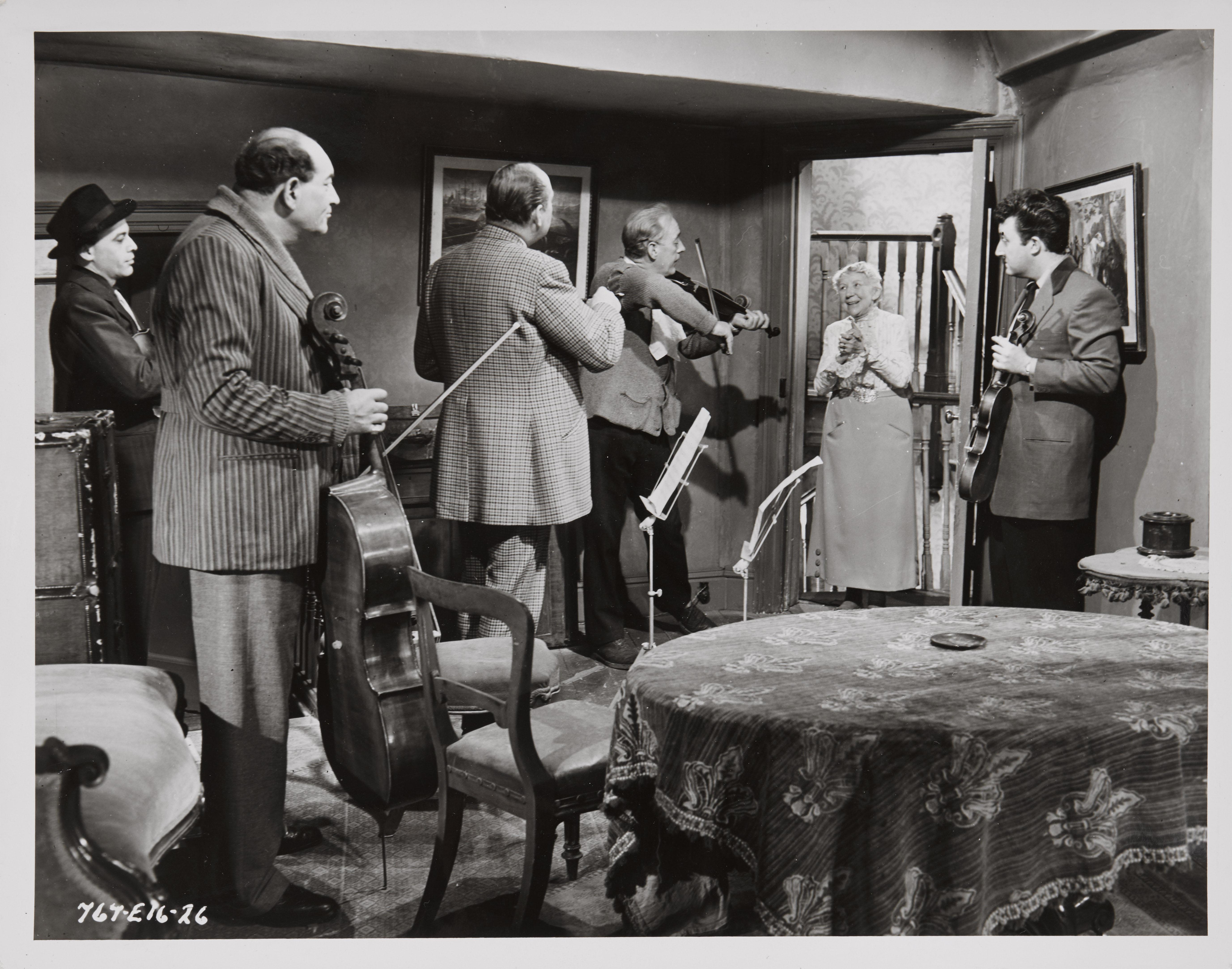 Original British photographic production stills for the classic Ealing comedy The Ladykillers starring Alec Guinness, Peter Sellers.
 