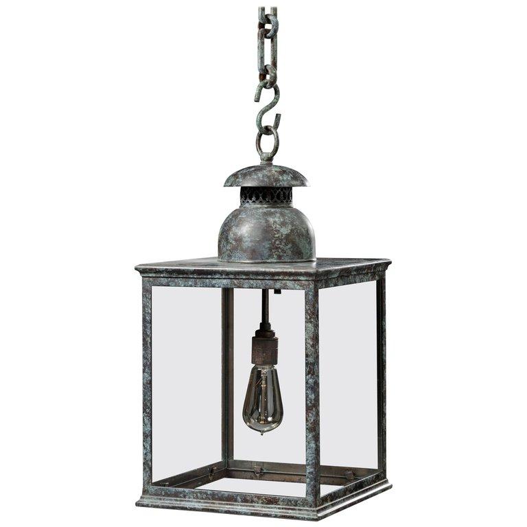 The Jamb Benson hanging lantern in patinated brass or copper. An elegant hanging solution to the Jamb Benson Wall Lantern.