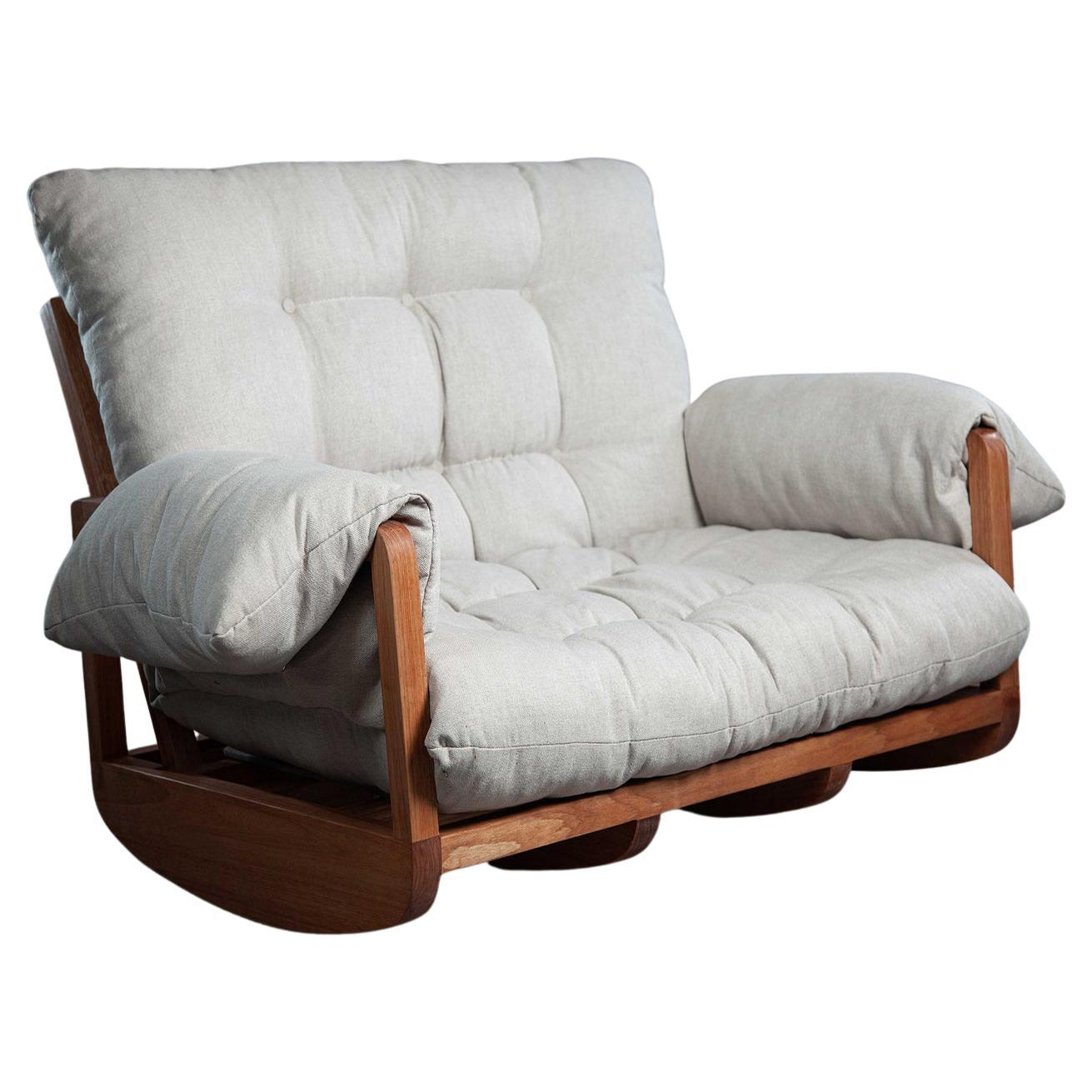 The Laziness Armchair. Rocking sofa in solid wood, upholstered in linen.