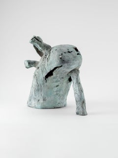 The leaning outcast, contemporary sculpure in cast bronze, white-green patina