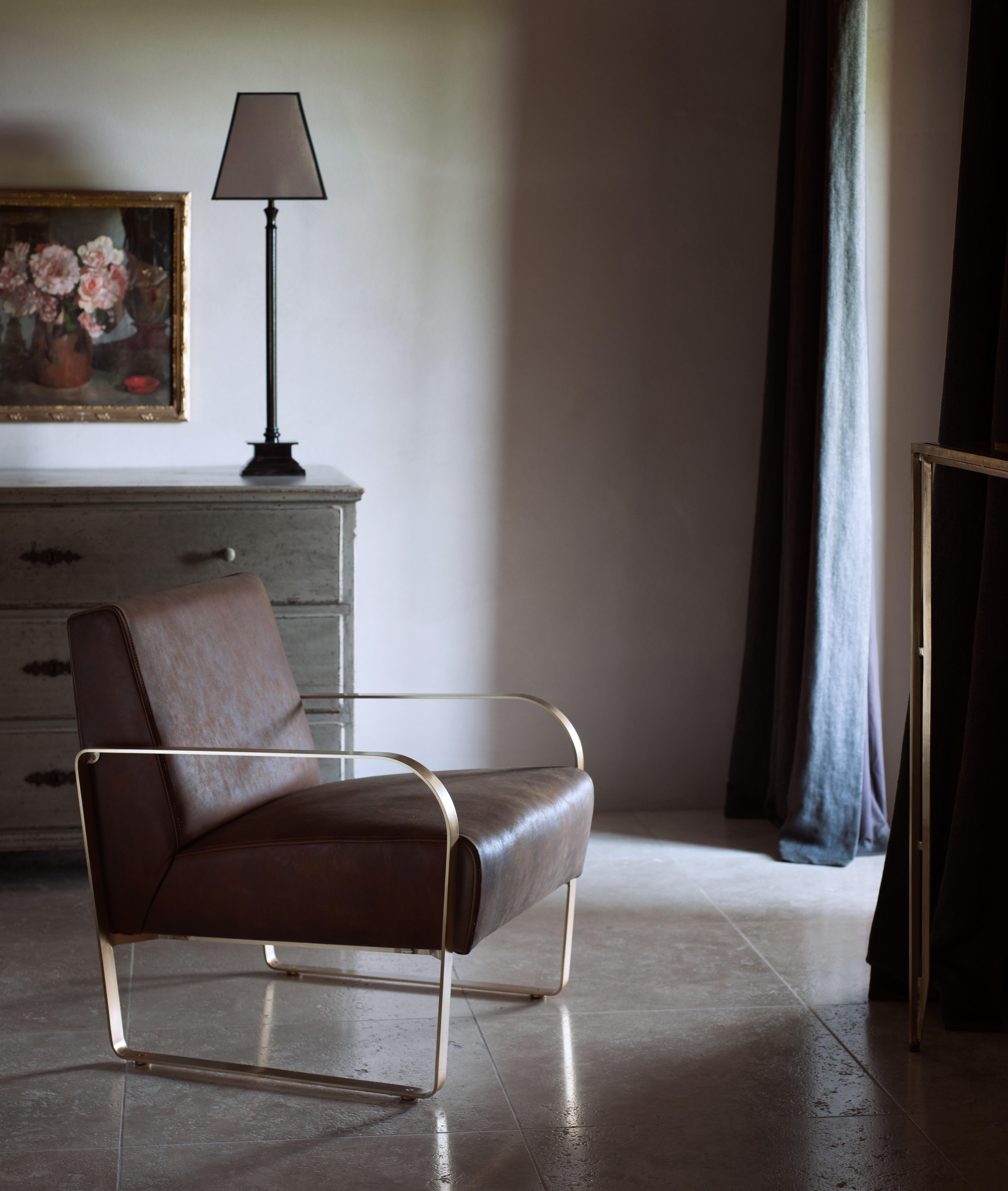 The leather armchair - A brass structure holding a superbly crafted handstitched leather seat.
B.B. - I love the Italian leather contrasting with the Classic 1930s brushed brass frame.