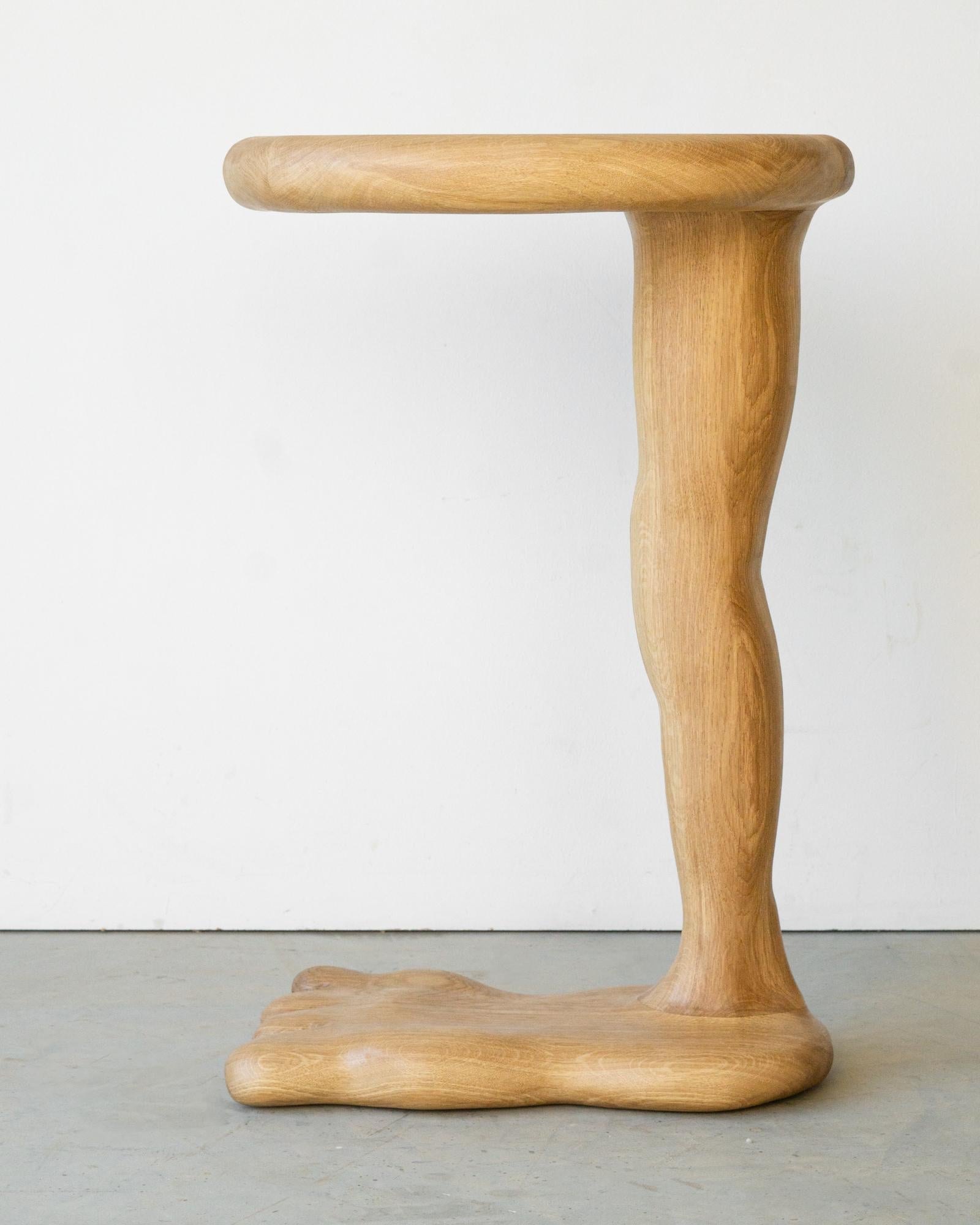 The Leg Side Table is sculpted using various hand tools, making each piece unique with its own distinctive wood grain. 

It is made from high-quality oak wood and finished with a natural hardwax oil, providing protection to the wood in daily use