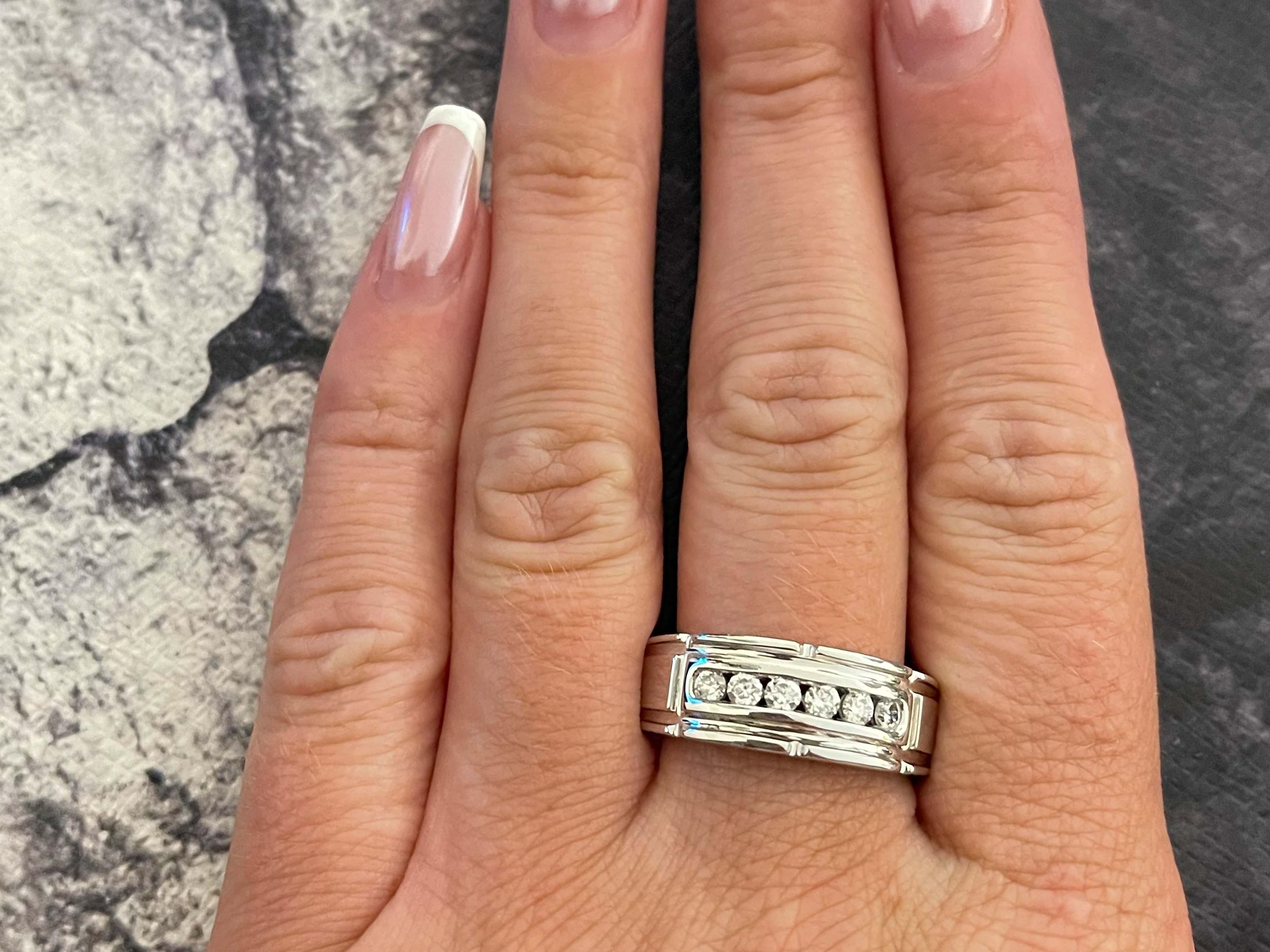 Item Specifications:

Metal: 14k White Gold 
​
​GSI Report #: 27363200121

Diamond Count: 6 brilliant cut

Diamond Carat Weight: ~3/8 carats

Diamond Color: I

Diamond Clarity: SI2

Ring Size: 9.75 (resizable)

Total Weight: 10.8 grams

Stamped: