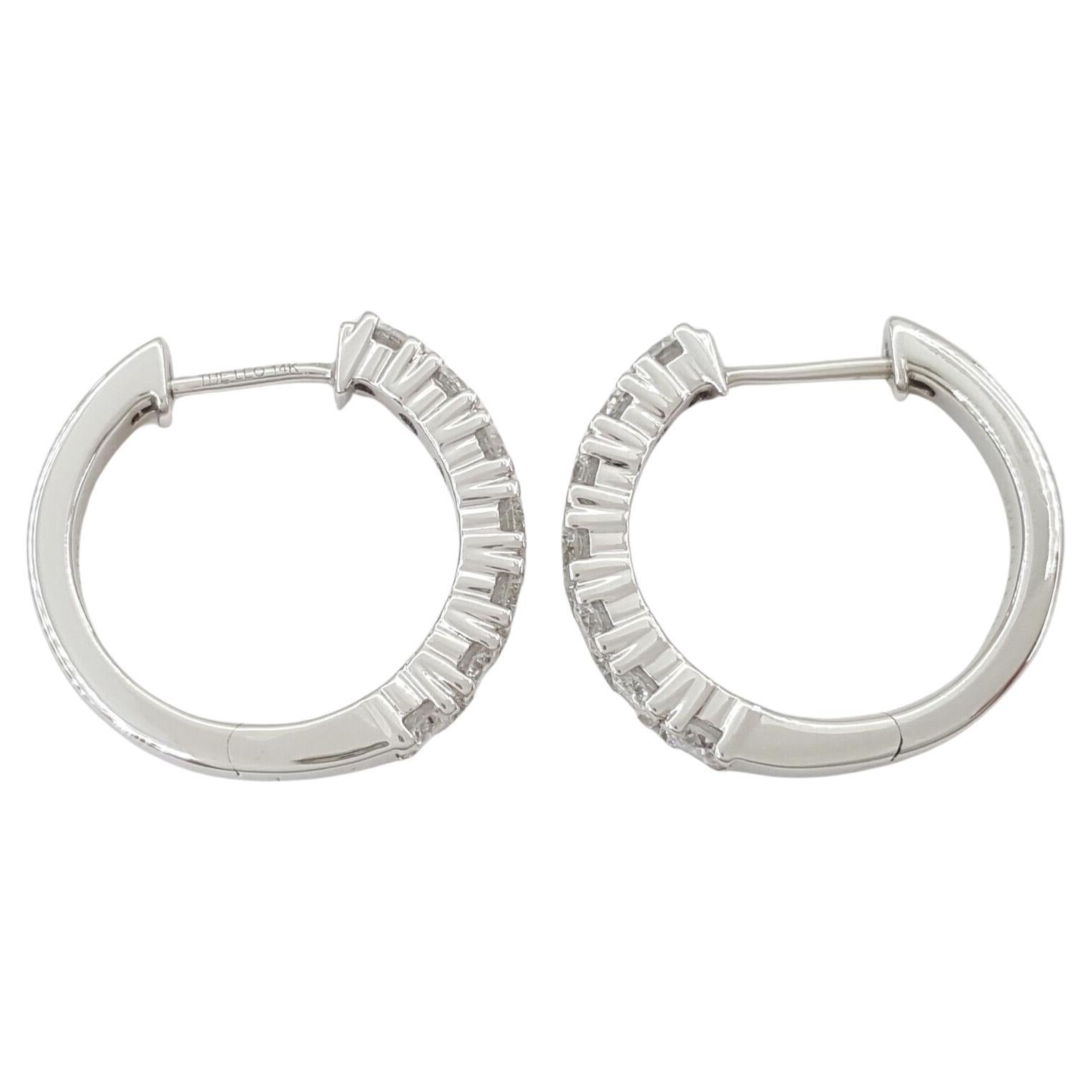 THE LEO 0.90 ct Round Brilliant Cut Diamond Round Huggie Hoop Earrings in 14K White Gold. 
The earrings weigh 4.1 grams, there are 14 Natural Round Brilliant Cut Diamonds weighing ~0.9 ct total weight. The diamonds are G-I in color and SI1-I1 in