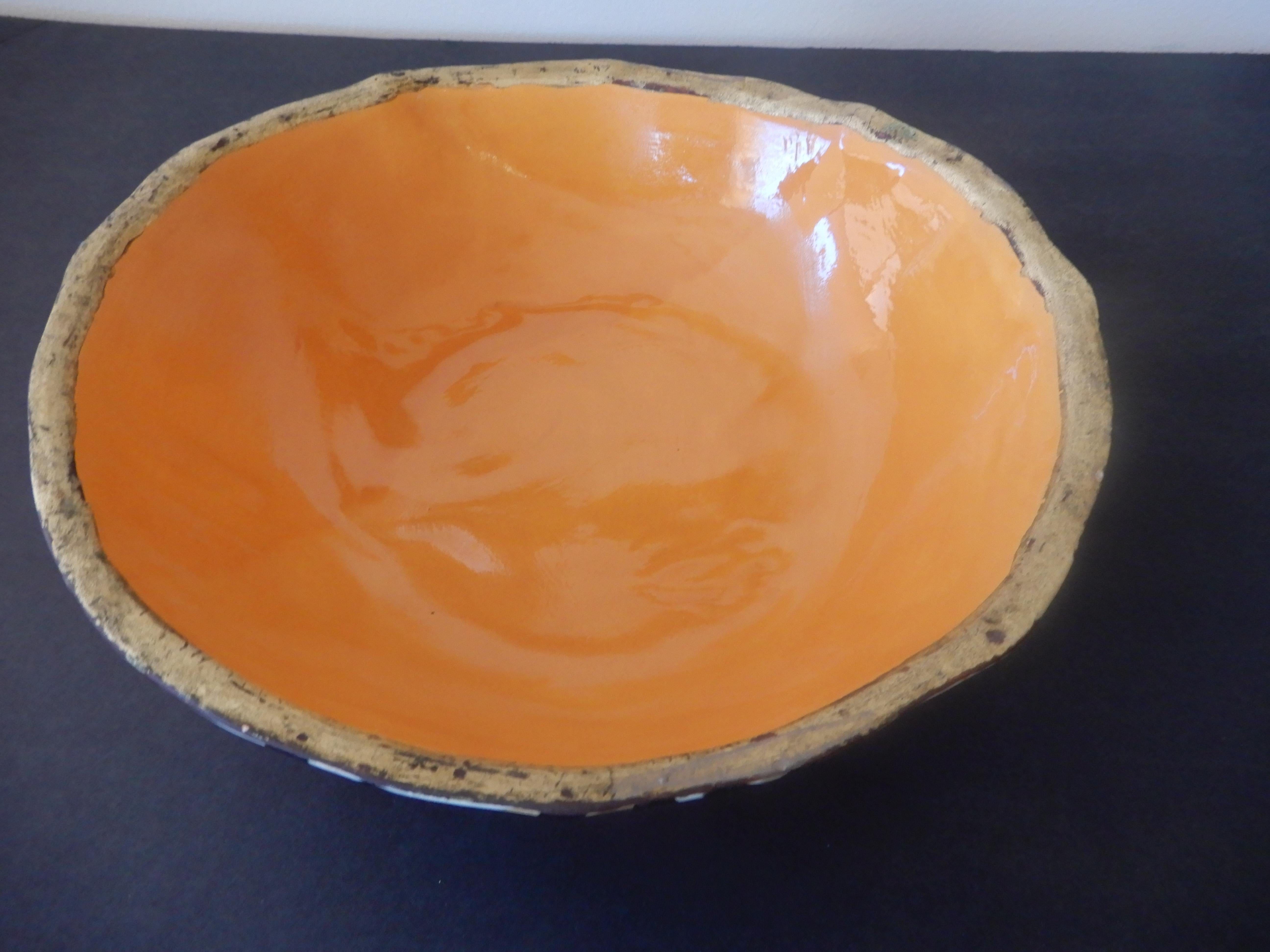 A rare find in this beautifully handcrafted modern artisan bowl by Brenda Holzke. Orange enamel with gold trim, hand painted leopard spots, signed, gorgeous and extremely rare.