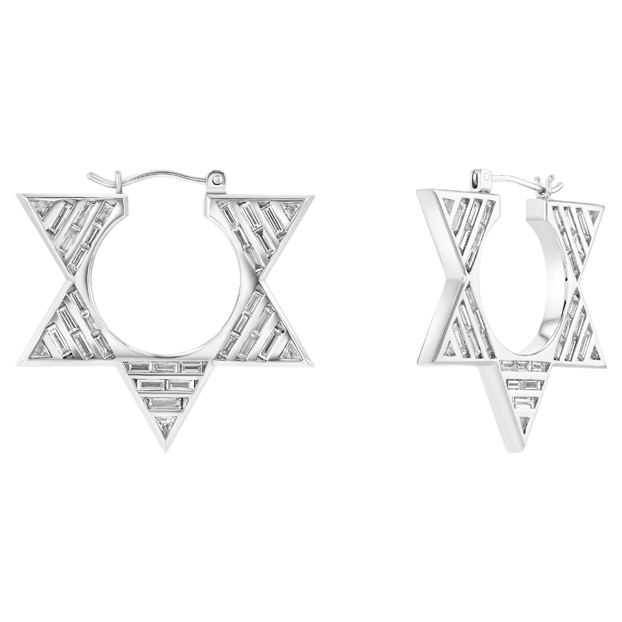 Double-sided hoops with over 4cts of natural baguette and trillion diamonds. A bold reimagination of the classic hoop, these striking earrings are crafted in 18k white gold, forming a dramatic circular silhouette adorned with dynamic diamond