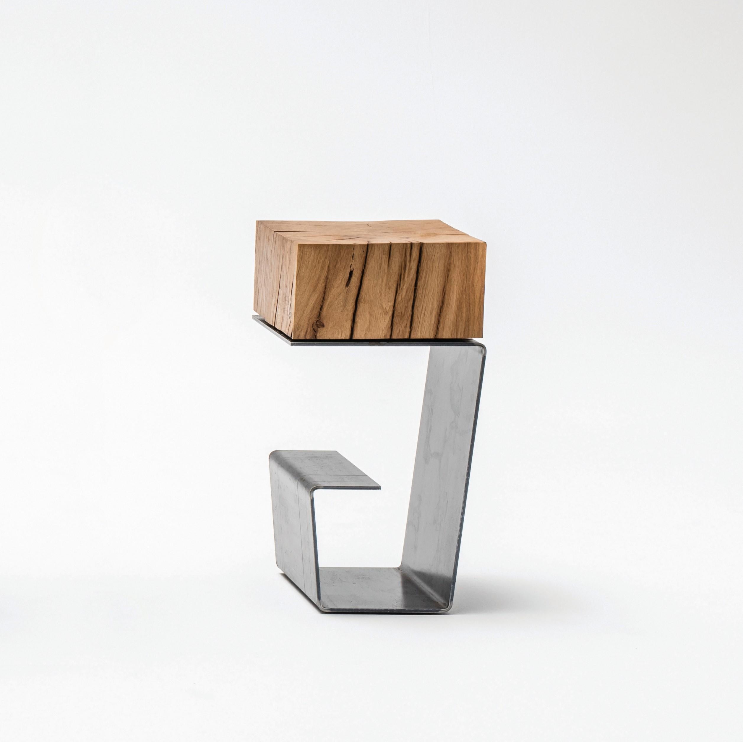 The line side table by Baker Street Boys
Dimensions: H 48.5 x W 25 x L 25cm
Materials: Steel, wood 

Due to different mixes of the materials the line can be divided into: The line (raw steel + oak) the white line (white painted steel + oak) the