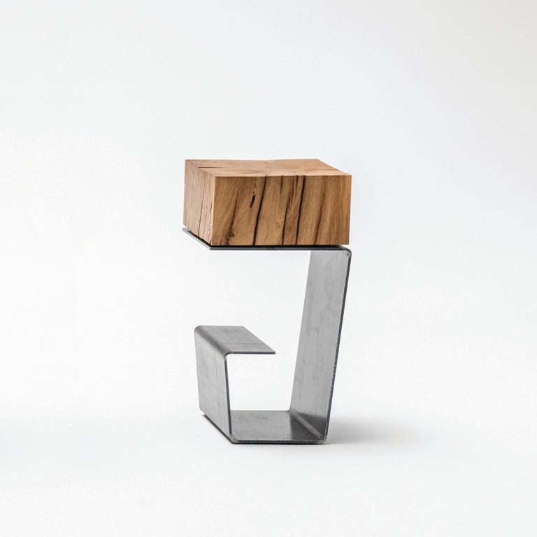 The line side table by Baker Street Boys
Dimensions: H 48.5 x W 25 x L 25cm
Materials: Steel, wood 

Due to different mixes of the materials the line can be divided into: The line (raw steel + oak) the white line (white painted steel + oak) the