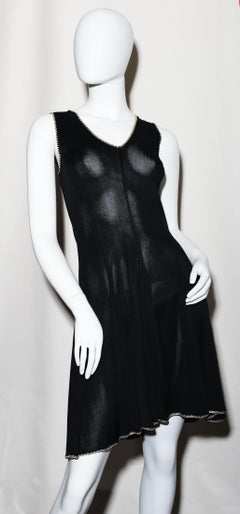 The little black dress by Chanel  black and white silk  Sculpted figure