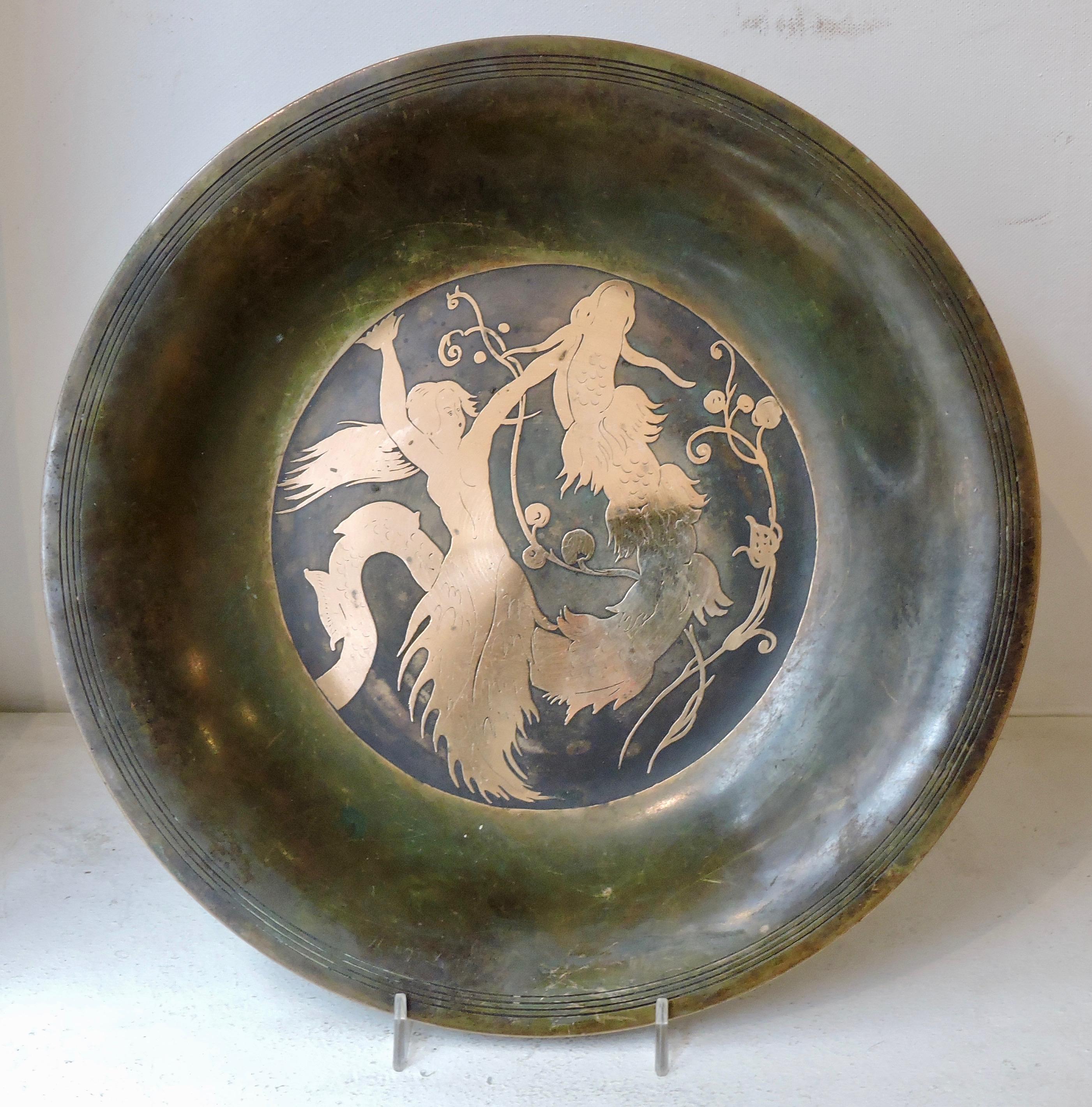Beautiful inlaid bronze patinated bowl designed by Just Andersen (1884-1943)
Inlaid scene of the little mermaid.
Designed by Danish bronze artist Just Andersen (1884-1943),
circa 1935.
Stamped and numbered on the back.