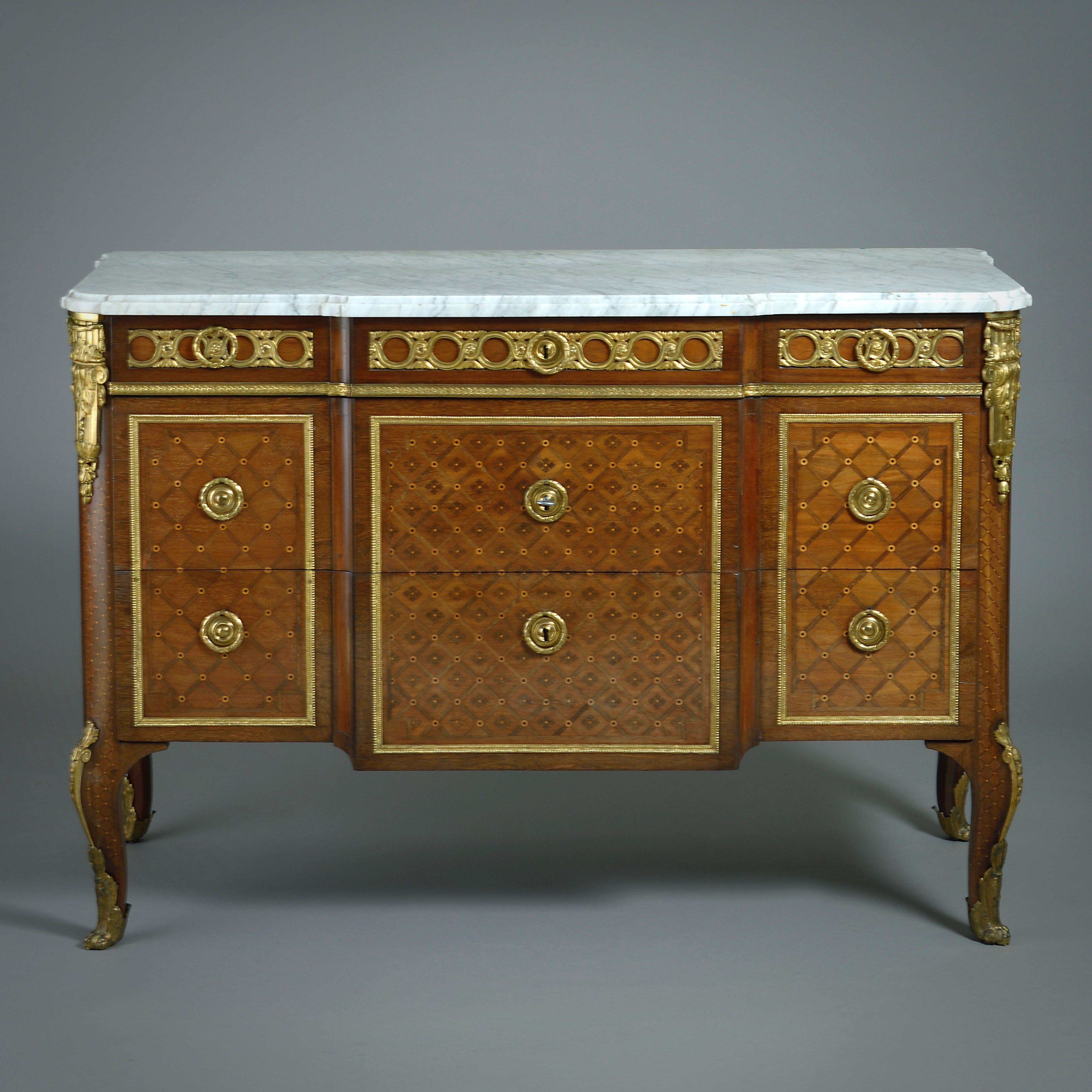 A MAGNIFICENT PAIR OF LATE LOUIS XV ORMOLU-MOUNTED PARQUETRY COMMODES PROBABLY SUPPLIED BY THE ÉBÉNISTE DU ROI GILLES JOUBERT (1689-1775), CIRCA 1770.
With minor variations, but almost certainly supplied as part of the same commission. Each with