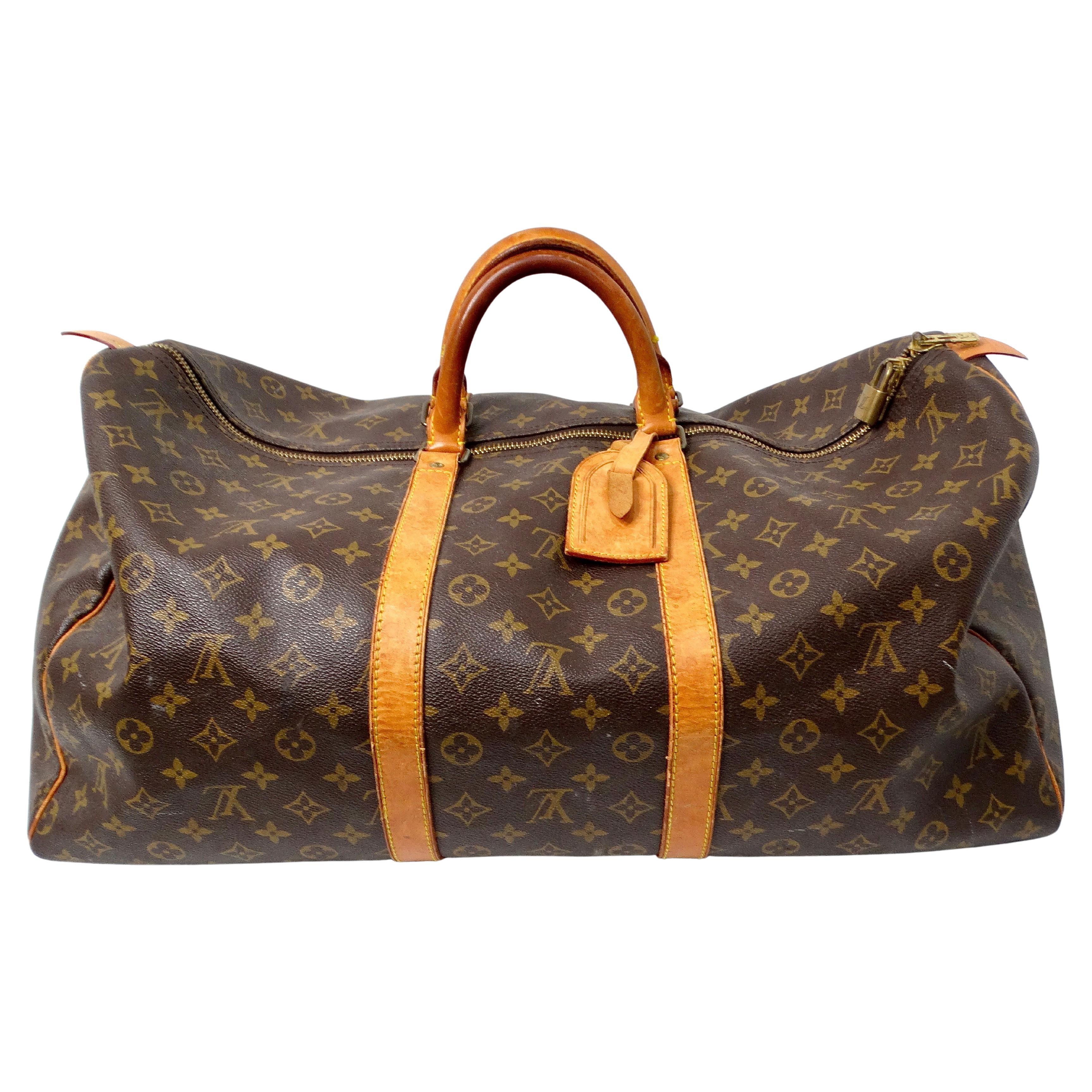 The Louis Vuitton Keepall 55 Monogram Coated Canvas Duffel Bag is a timeless and versatile piece that embodies luxury and practicality. Crafted from iconic Monogram coated canvas, it offers durability while maintaining an effortlessly stylish