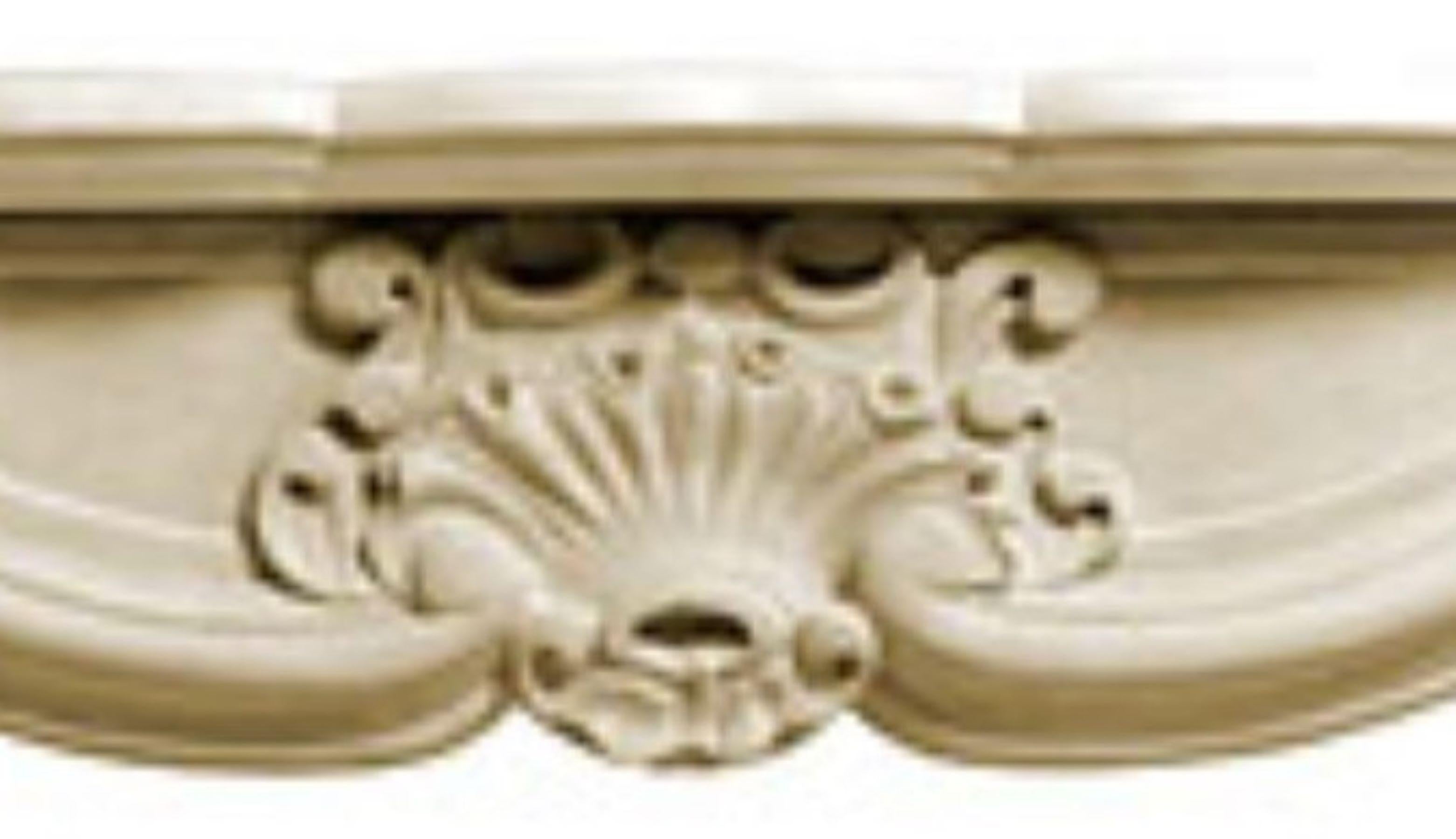 The Louis XV stone fireplace includes a curving top opening, typical of the 18th century Louis XV era in France.  There are many variations of this fireplace style, but ours includes a detailed anthemion carving as the centerpiece of the lintel,