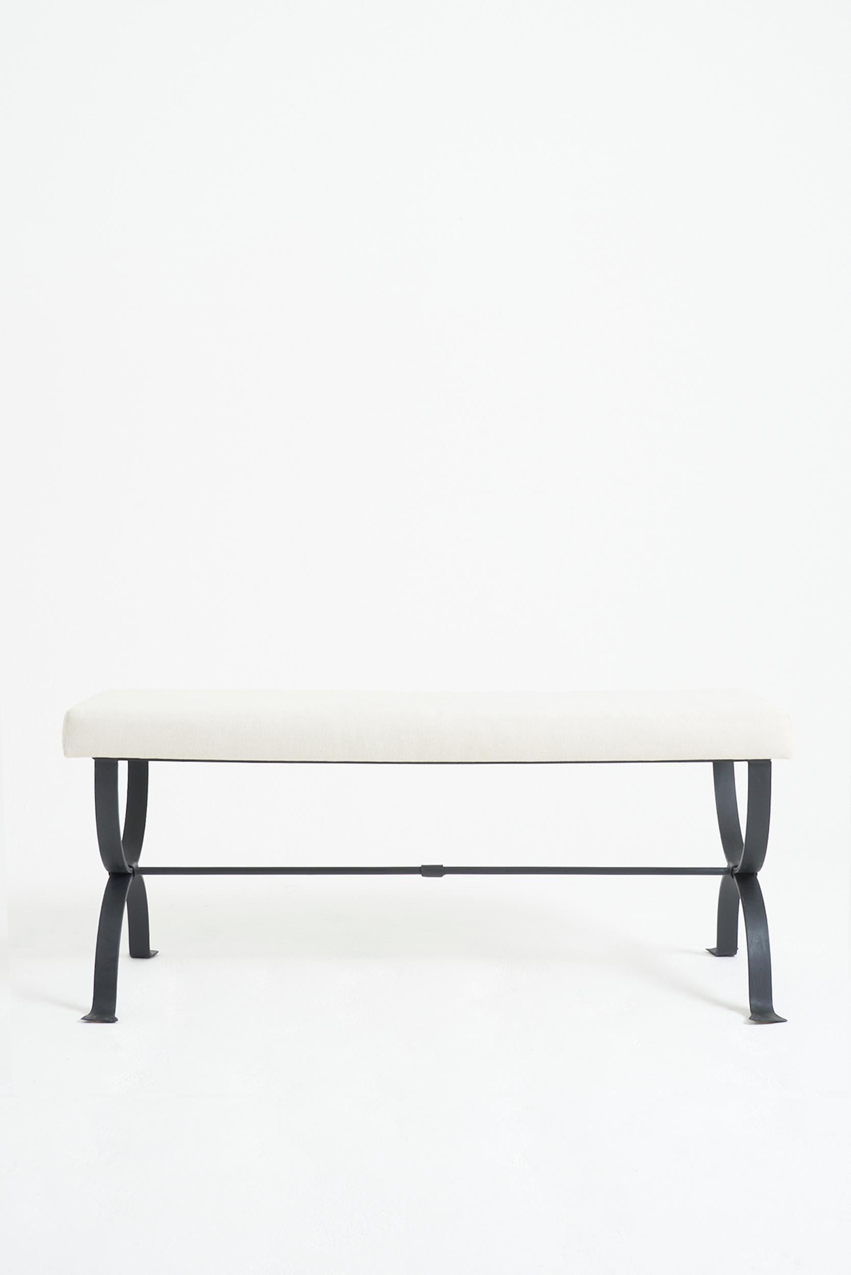 The 'Mahón' long stool, by Dorian Caffot de Fawes.
Black enamelled forged iron frame.
Hand made in Spain, upholstered in London.
50 cm high by 124 cm wide by 45 cm depth