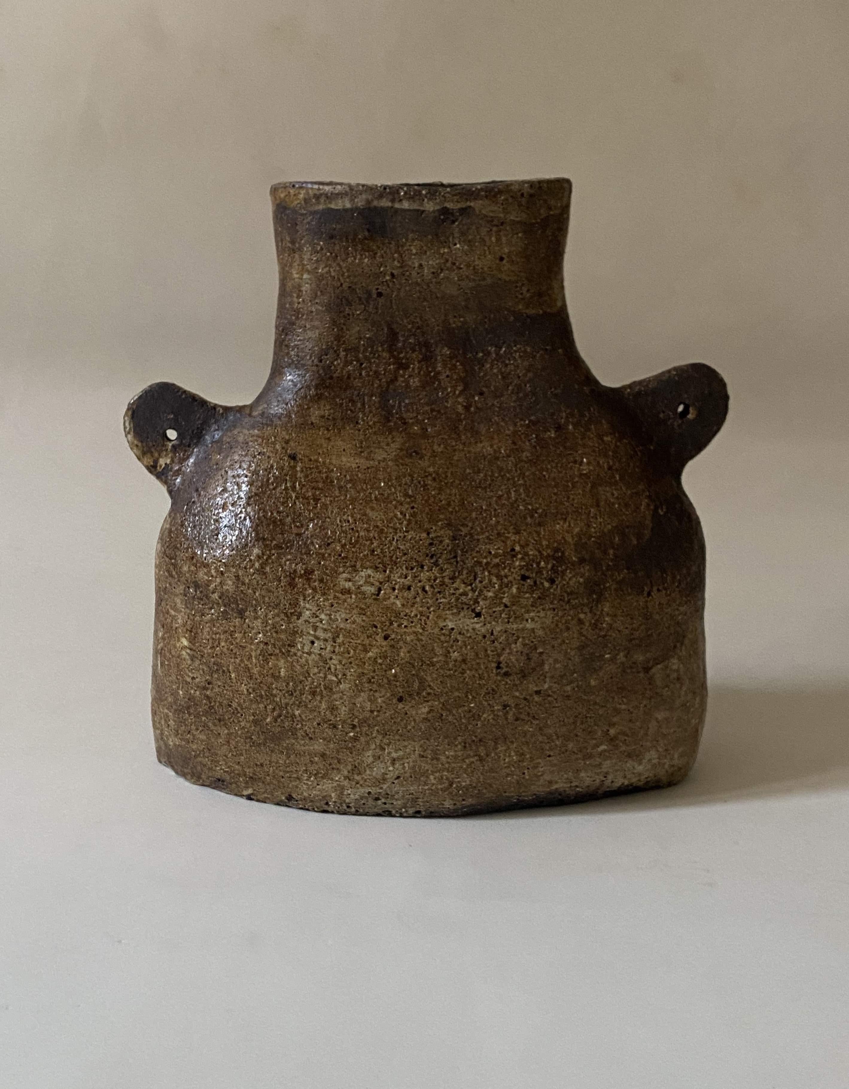 The Mallorquin A Vessel by Oikos Estudio
Handmade
Dimensions: D 25 x W 10 x H 35 cm (Dimensions may vary).
Materials: High-fired stoneware, wild pigments, glazing.

Available in black, dark brown, and yellow.
Each piece is unique and might show