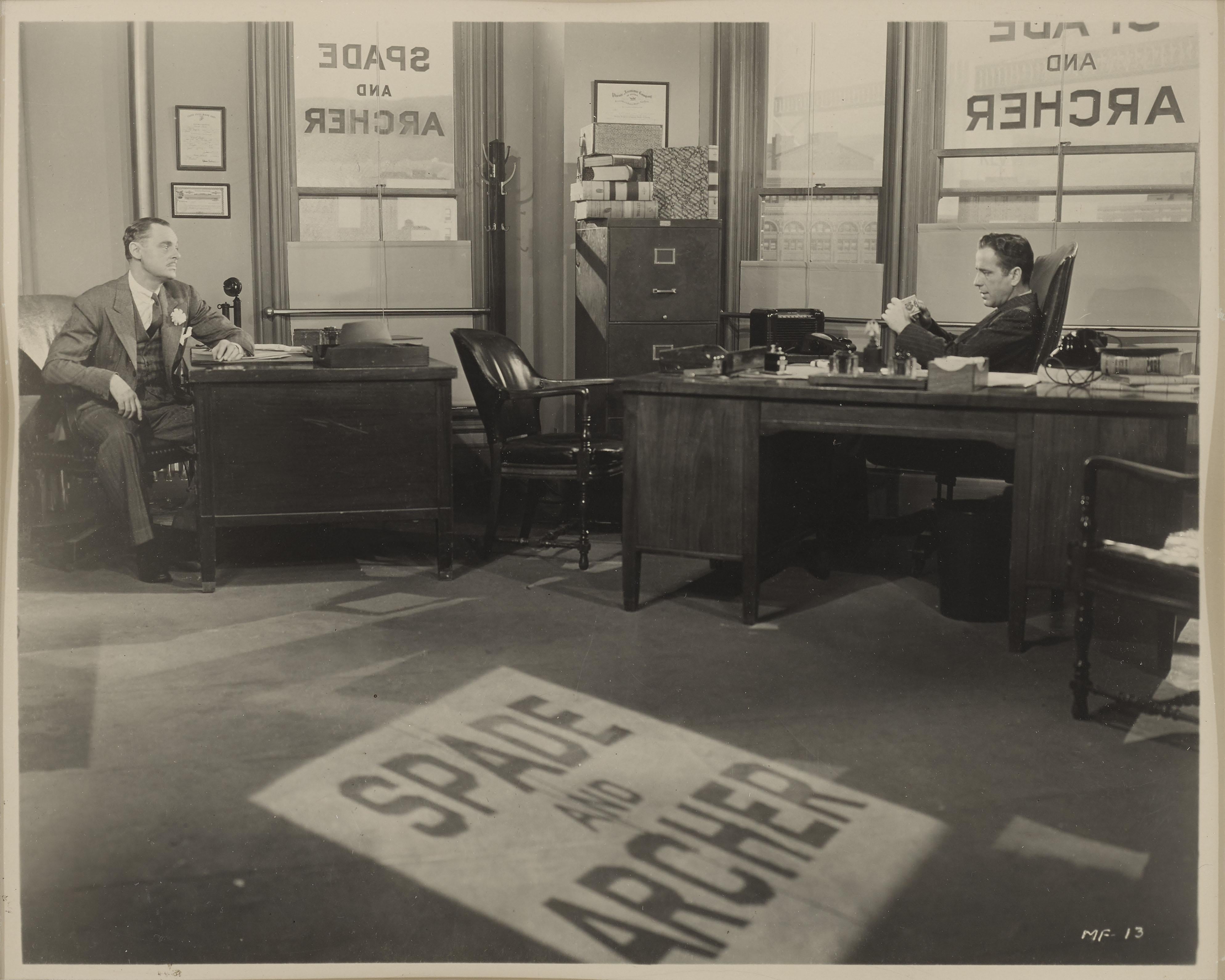 Original US photographic production still from The Maltese Falcon 1941.
The film Starred Humphrey Bogart, Peter Lorre and Mary Astor and was was directed John Huston.
This piece is conservation framed in a Sapele wood frame with acid free card