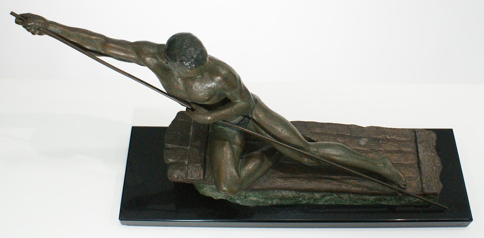 This piece has a green bronze patina showing a man on a raft mounted on a Belgium black marble base with the signature of the artist Ugo Cipriani.