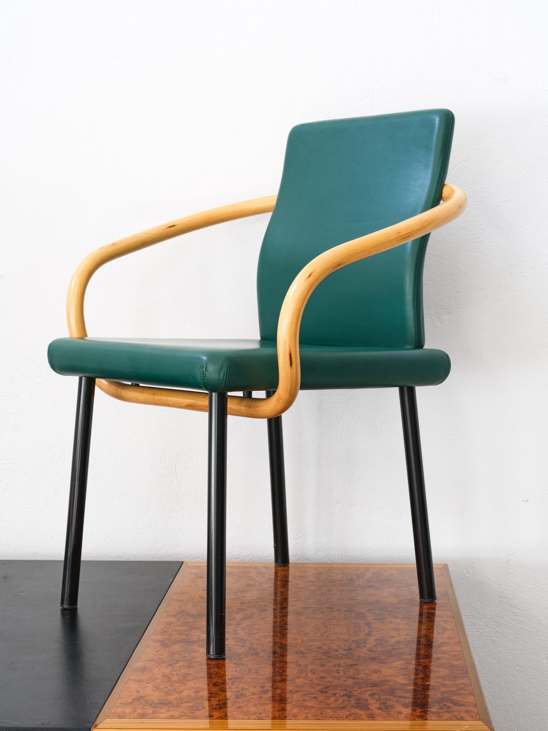 The Mandarin chair by Ettore Sottsass for Knoll, 1986.
The Mandarin Chair was a particular favorite for corporate interiors, restaurants and libraries. Its flowing, sculptural arm invoked the turn-of-the-century bentwood designs of Thonet, and was