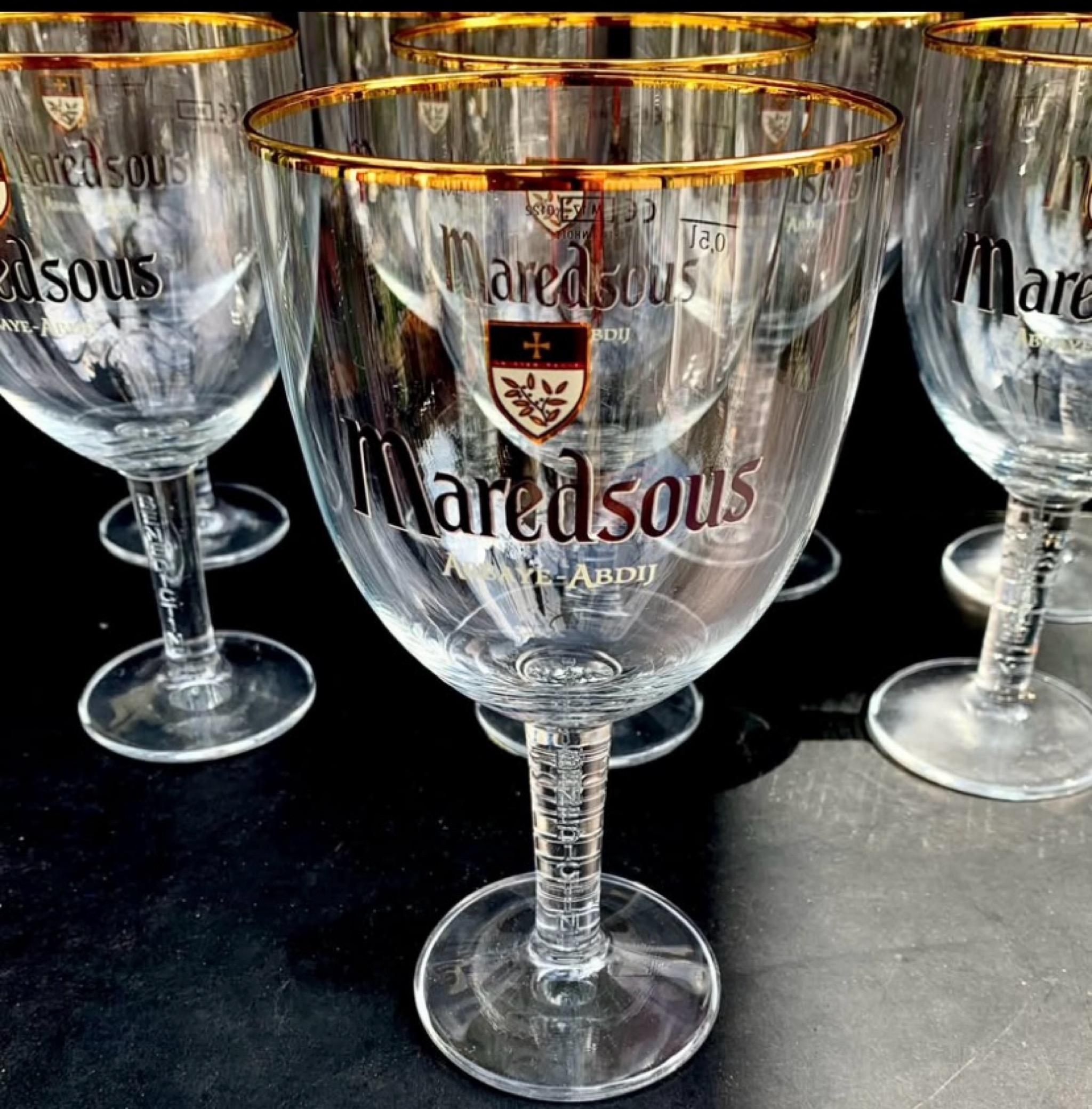 A set of eight Belgian Benedictine Monks Maredsous Abbaye Abdij Beer Goblets with 24 karat gold trim. A beautiful 