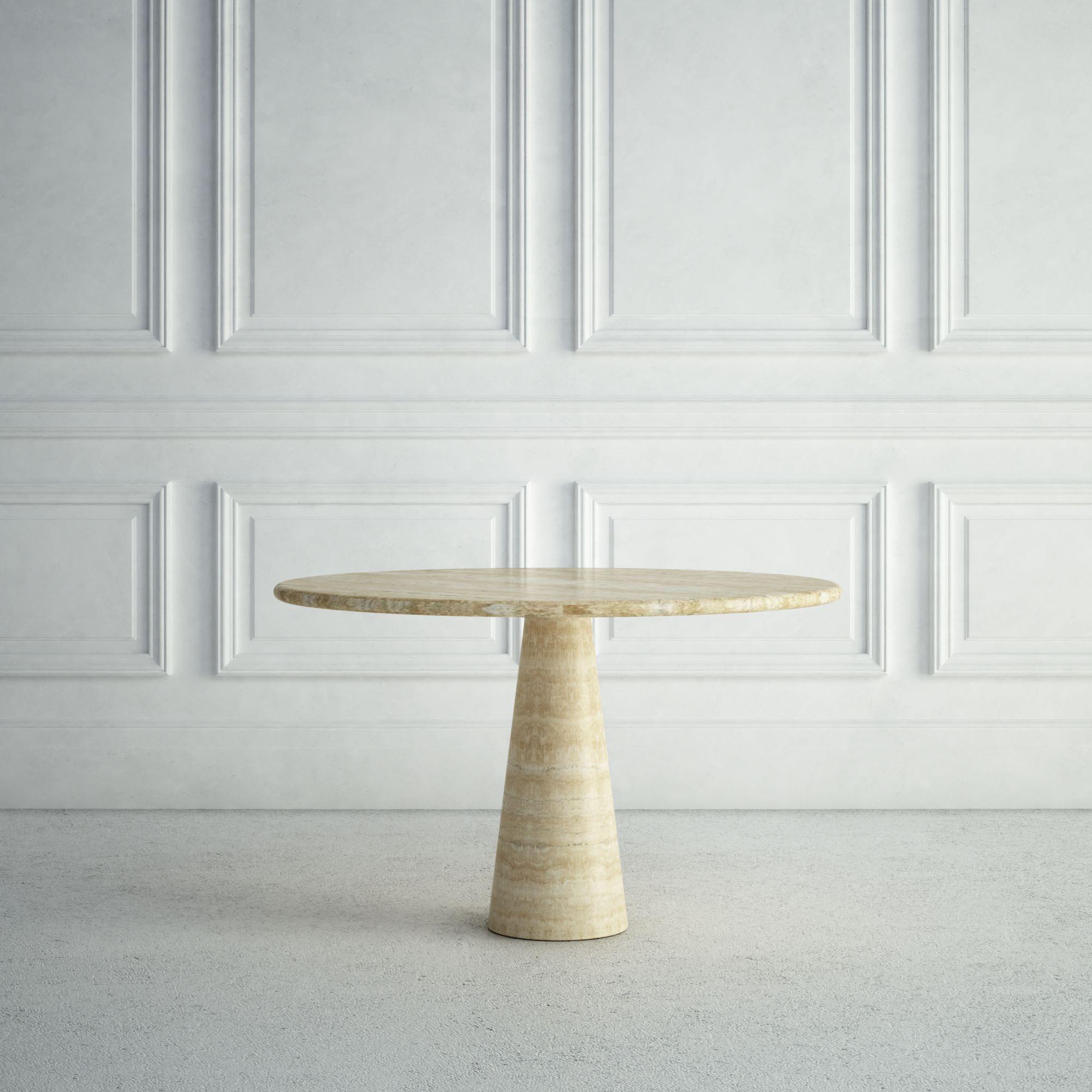 The Margaux is a smaller, modern stone dining table, with a round top, and a bullnose edge detail.  The base is also rounded, but tapers as it goes up, forming a playful conical shape.  All of these elements give it a stylish, modern, fun look.  The