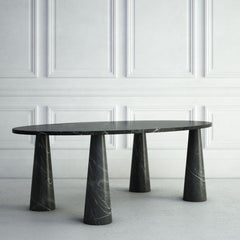 The Marianne: A Modern Stone Dining Table with an Oval Top and Four Tapered Legs
