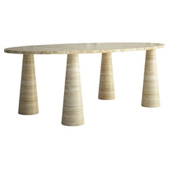 The Marianne: A Modern Stone Dining Table with an Oval Top and Four Tapered Legs