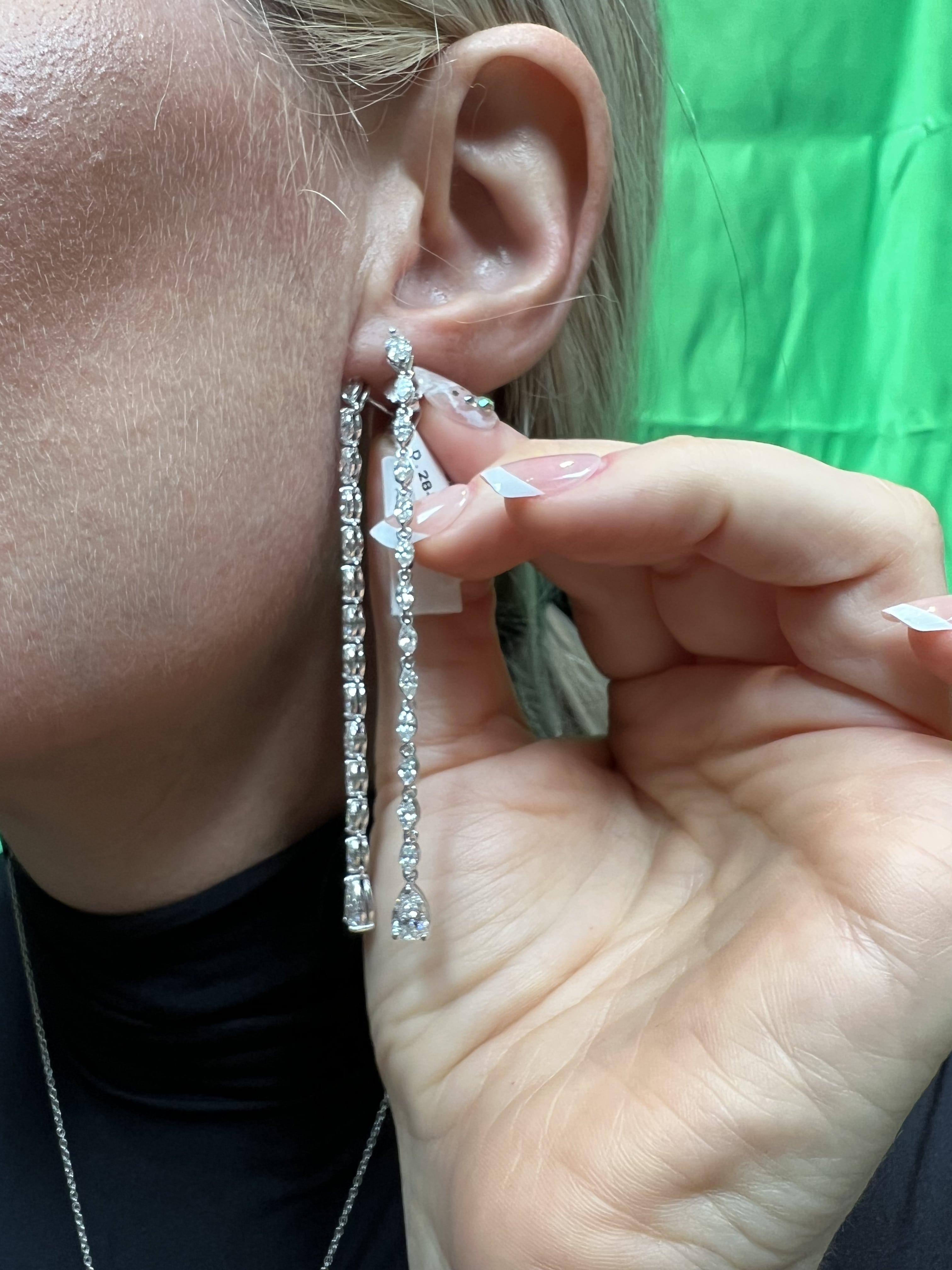 Elegant and timeless, Round Diamond 14K White Gold Tennis Earrings are designed to captivate with their exquisite craftsmanship. Featuring a stunning combination of pear and marquise diamonds set in 14k white gold, these earrings add a touch of