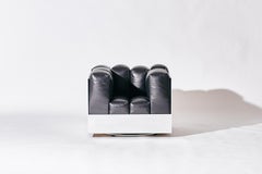 The Marshmallow Lounge -Swivel Lounge Chair in Black Leather with Aluminum Frame