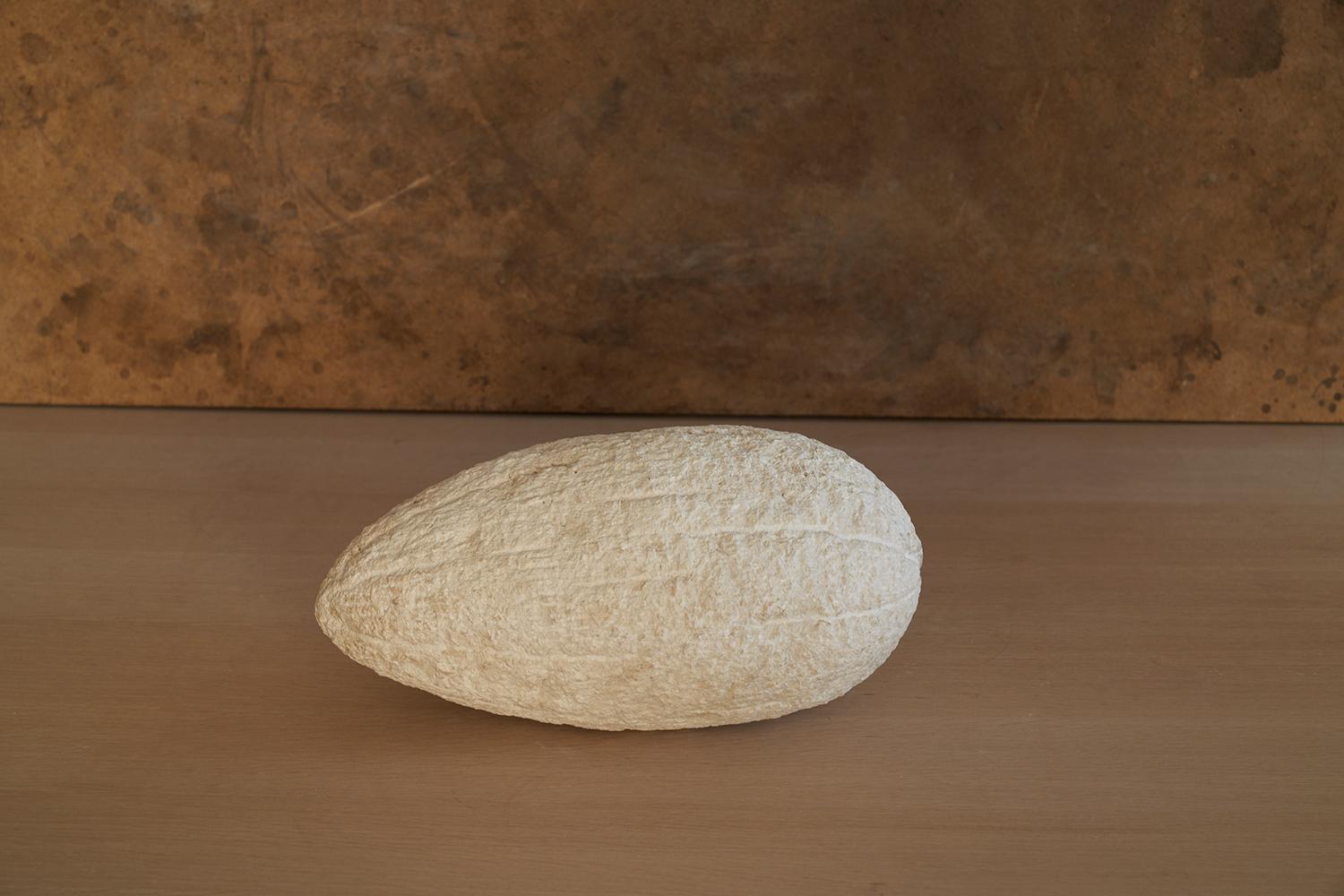 The Melon Sculpture by Jean-Baptiste Van Den Heede
Unique piece
Dimensions: W 35 x D 18 x H 18 cm
Materials: Stone.

Jean-Baptiste Van den Heede defines himself as a cabinetmaker-designer and an artist of academic training and family tradition. He