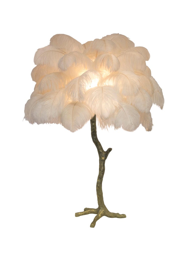 Our mini palm ostrich feather lamp is a bijoux version of the exquisite, illuminating ostrich feather floor lamp. Each piece delivers a glorious luxurious statement to any design or styling project - perfect in Pairs! Handmade in our Oxfordshire