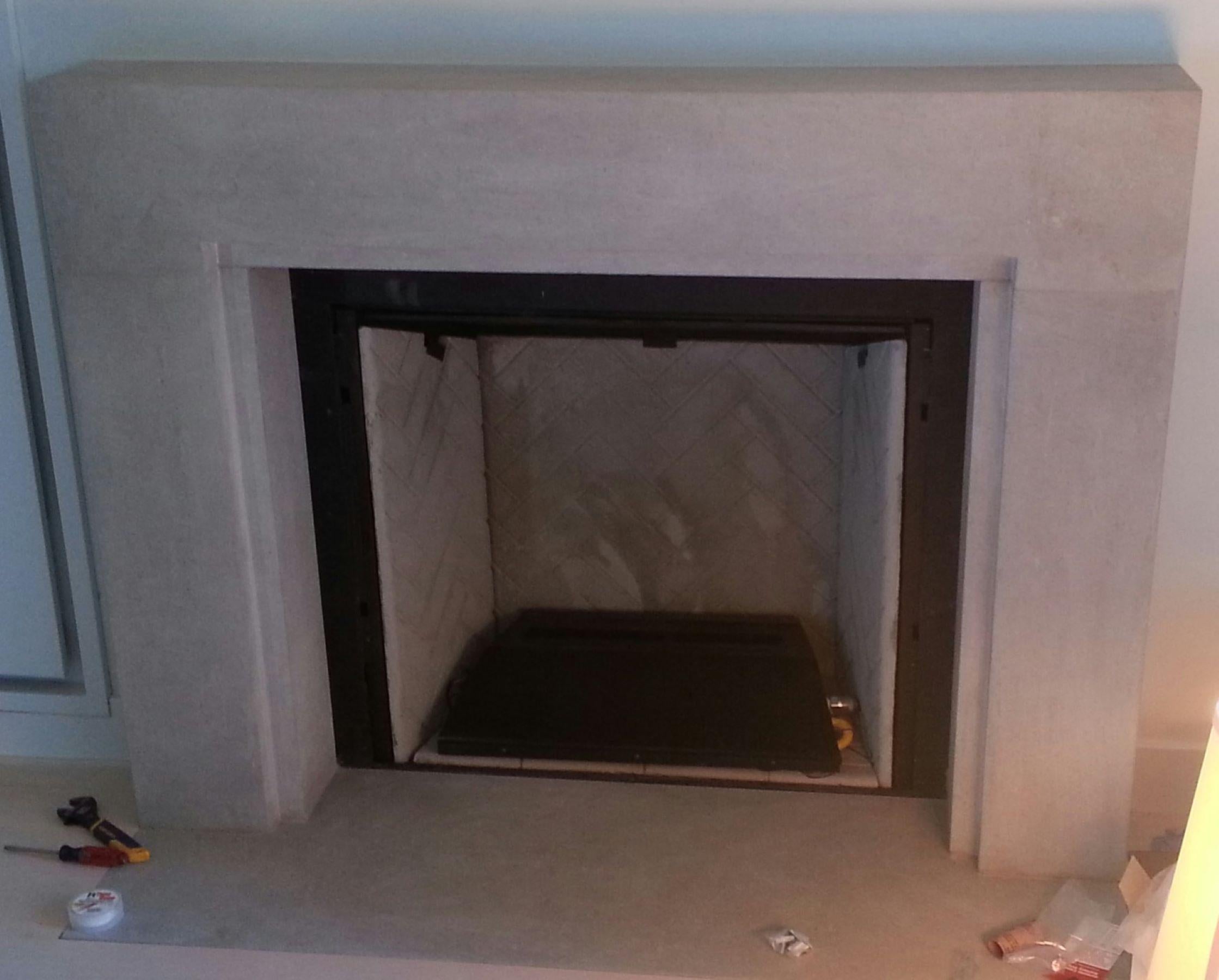 Carved The Minimalist: A Modern Stone Fireplace with a Stepped-in Frame For Sale