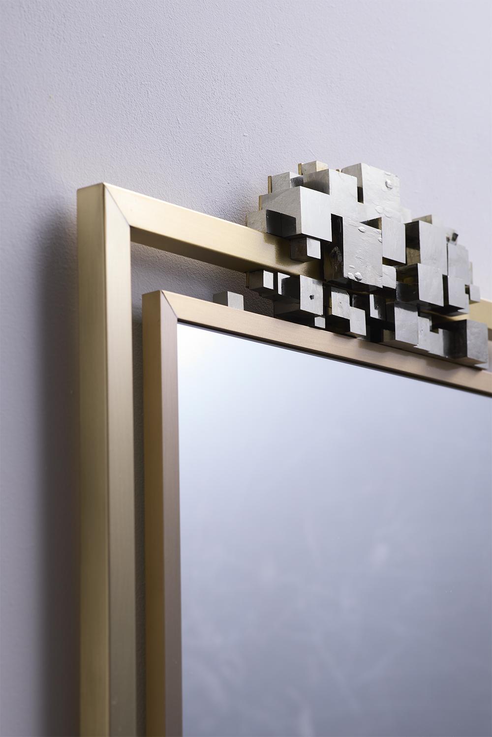 Set of pyrites around a mirror.

__

Creation : Antoine DARIULE 

Antoine DARIULE is a metal artist and designer. 
He produces high-quality objets d'art, furniture and lighting. 

His favourite material is metal. An ideal material, a symbol of
