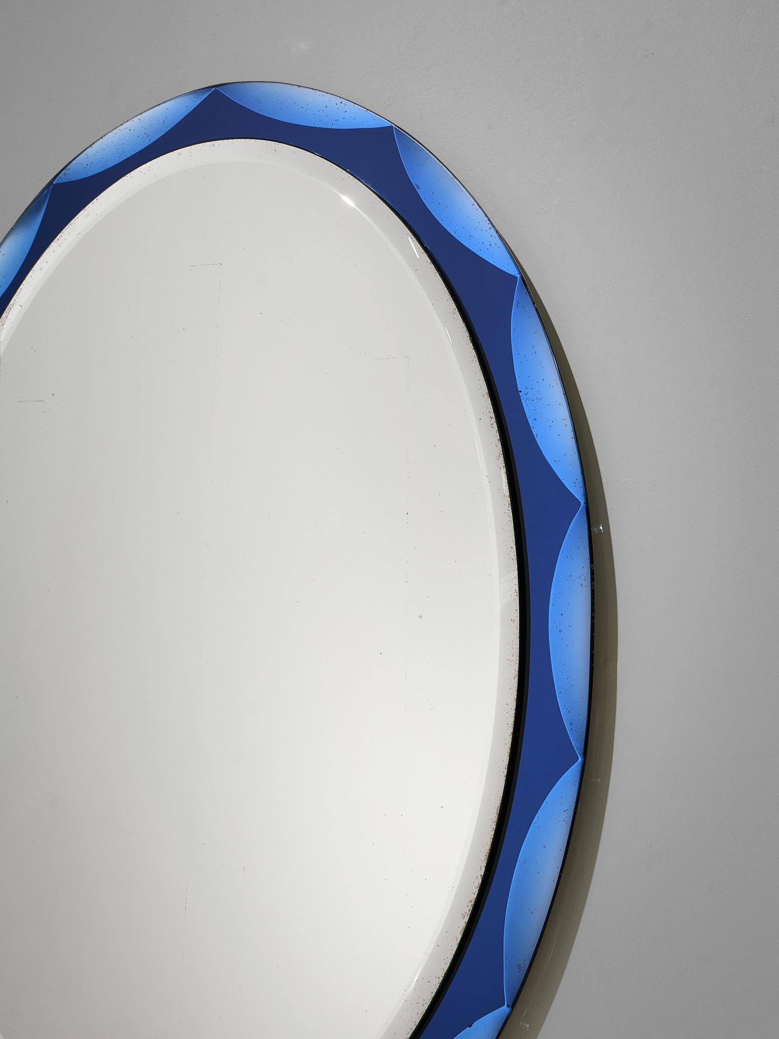 20th Century Mirror Is Surrounded by Beveled Blue Glass Panels, Placed in a Gilt Brass