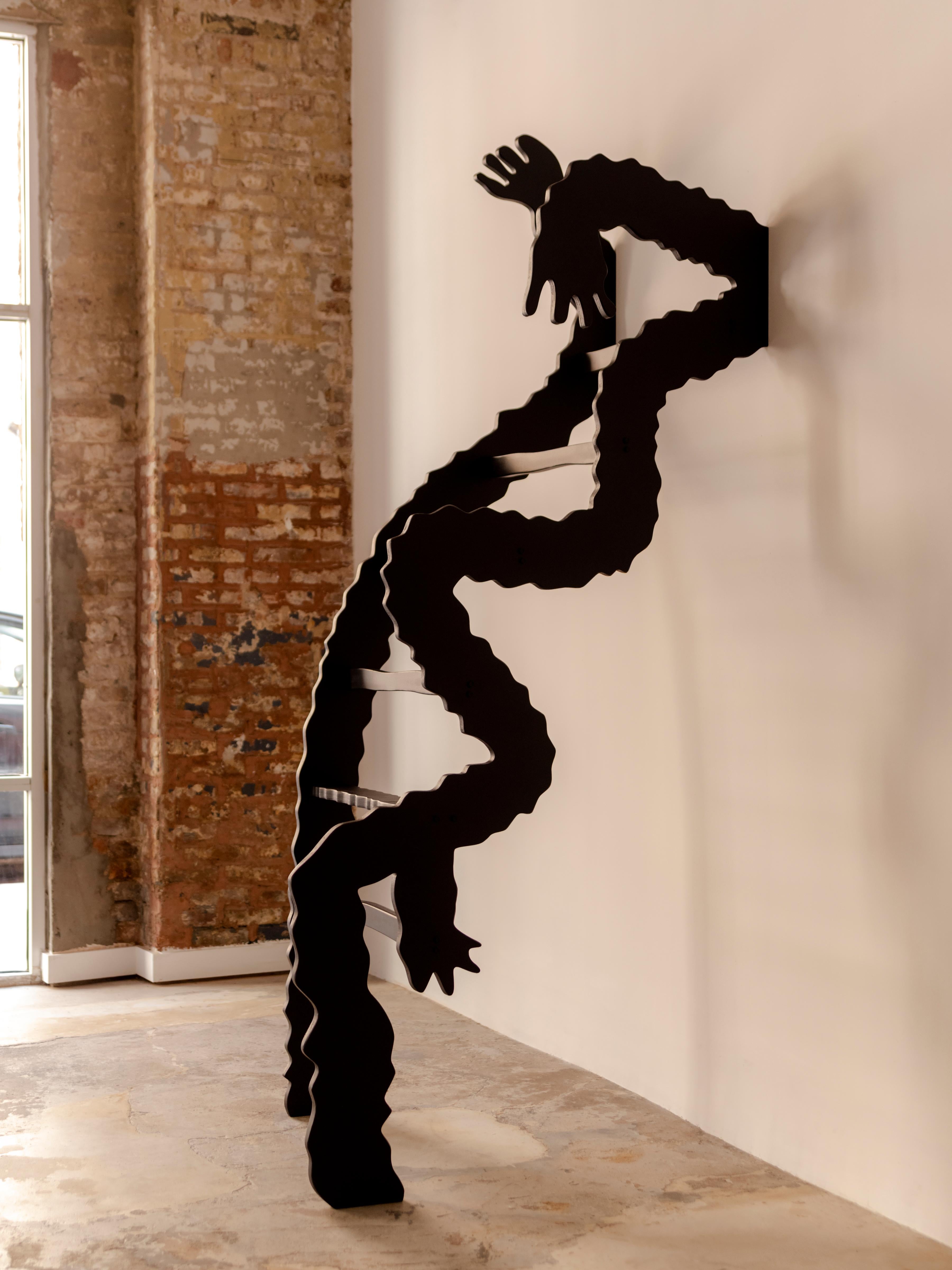 The ladder installation called “The Monster” combines large black, whimsical, and abstract shapes that mimic arms and hands.
Installation and shipment to be quoted separately. 