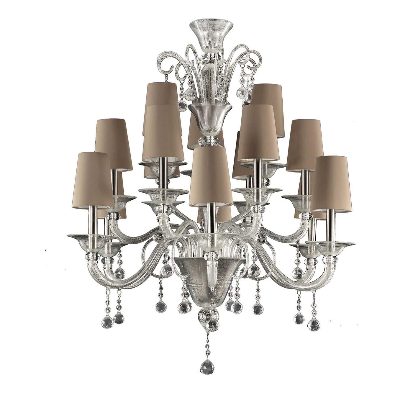 From the timeless line, the Multiforme collection dedicated to the Classic Murano chandeliers, comes the Murano chandelier in clear glass, with silver leaf. The elegant handcrafted lampshades are made from a refined cream colored cotton and feature
