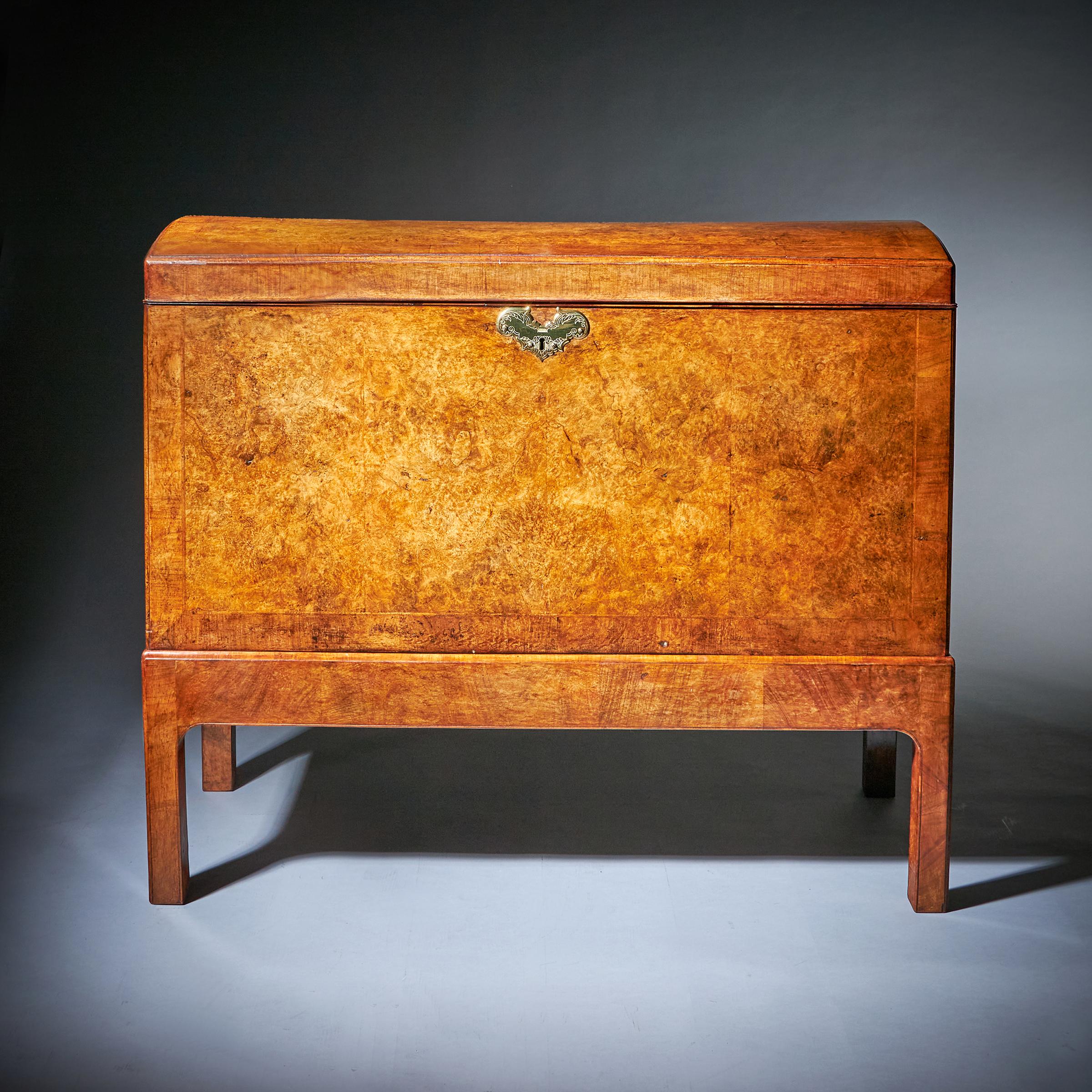 The Countess Mountbatten of Burma early 18th century George I Burr Walnut Chamber Chest. C.1710-1730. England

The cross and feather-banded burr walnut domed top chest opens to reveal 18th-century handpainted Chinese export wallpaper.