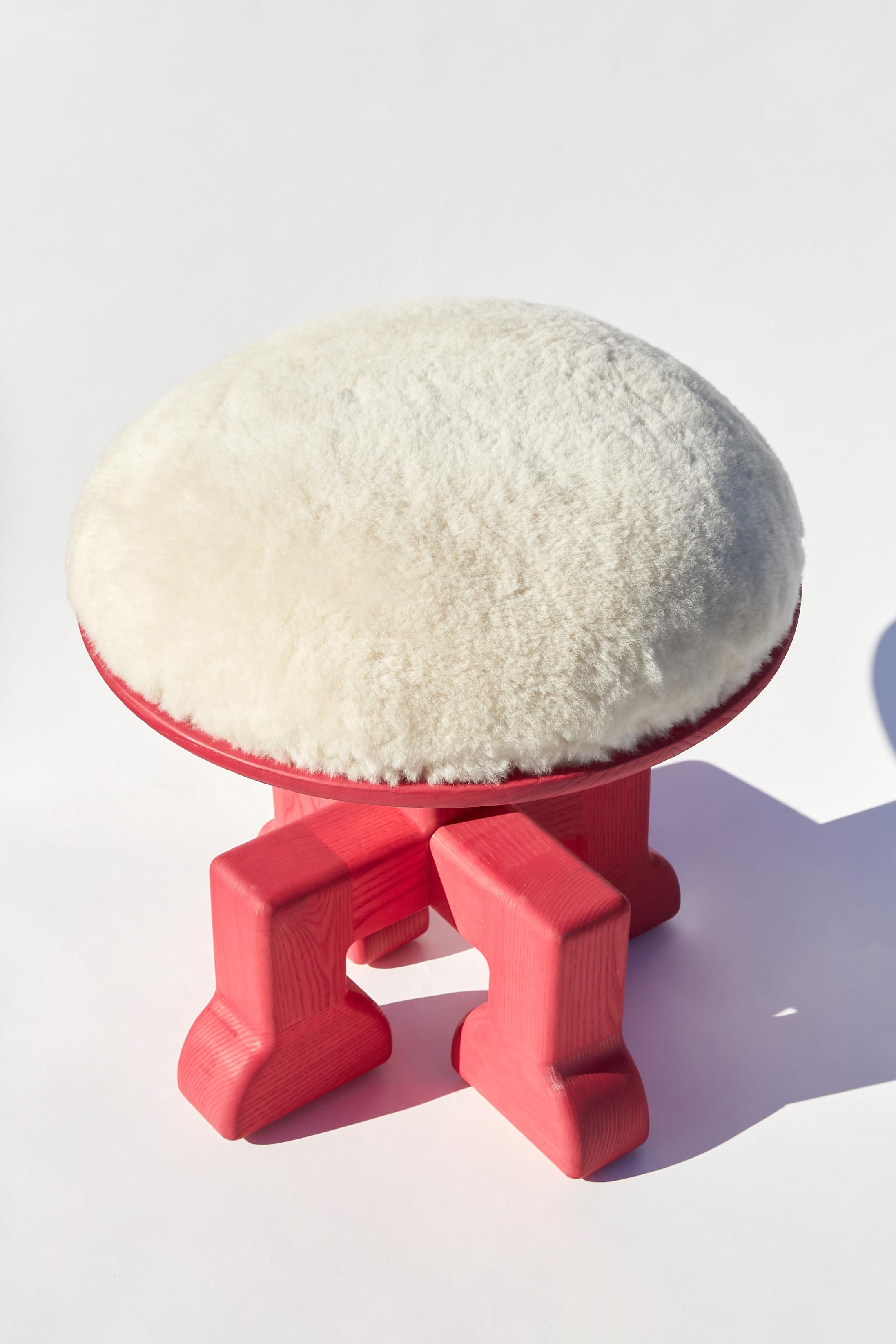 Muffin-Man: The plushest stool. Handmade with ash and upholstered with shearling. The ash is stained using a non-toxic linseed-based satin wood stain. The cushion is made up of natural latex, cotton, wool, and horse hair. Designed to be simply fun