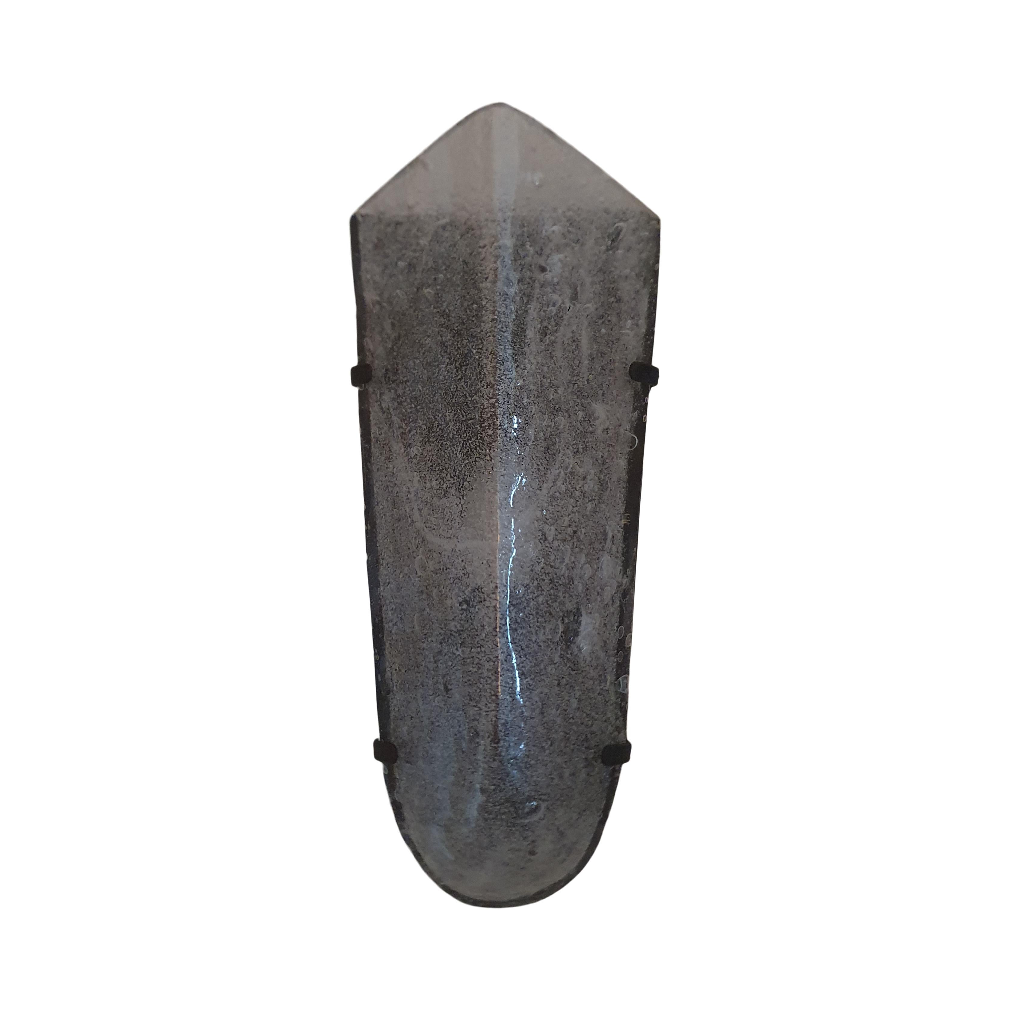 The Ice Wall Sconce was designed by Andrew for his own collection in 2017 in collaboration with a Master Glass Blower in Venice on the island of Murano

The mouth blown glass shade is made in one piece of Clear Cristallo Glass with granulated glass