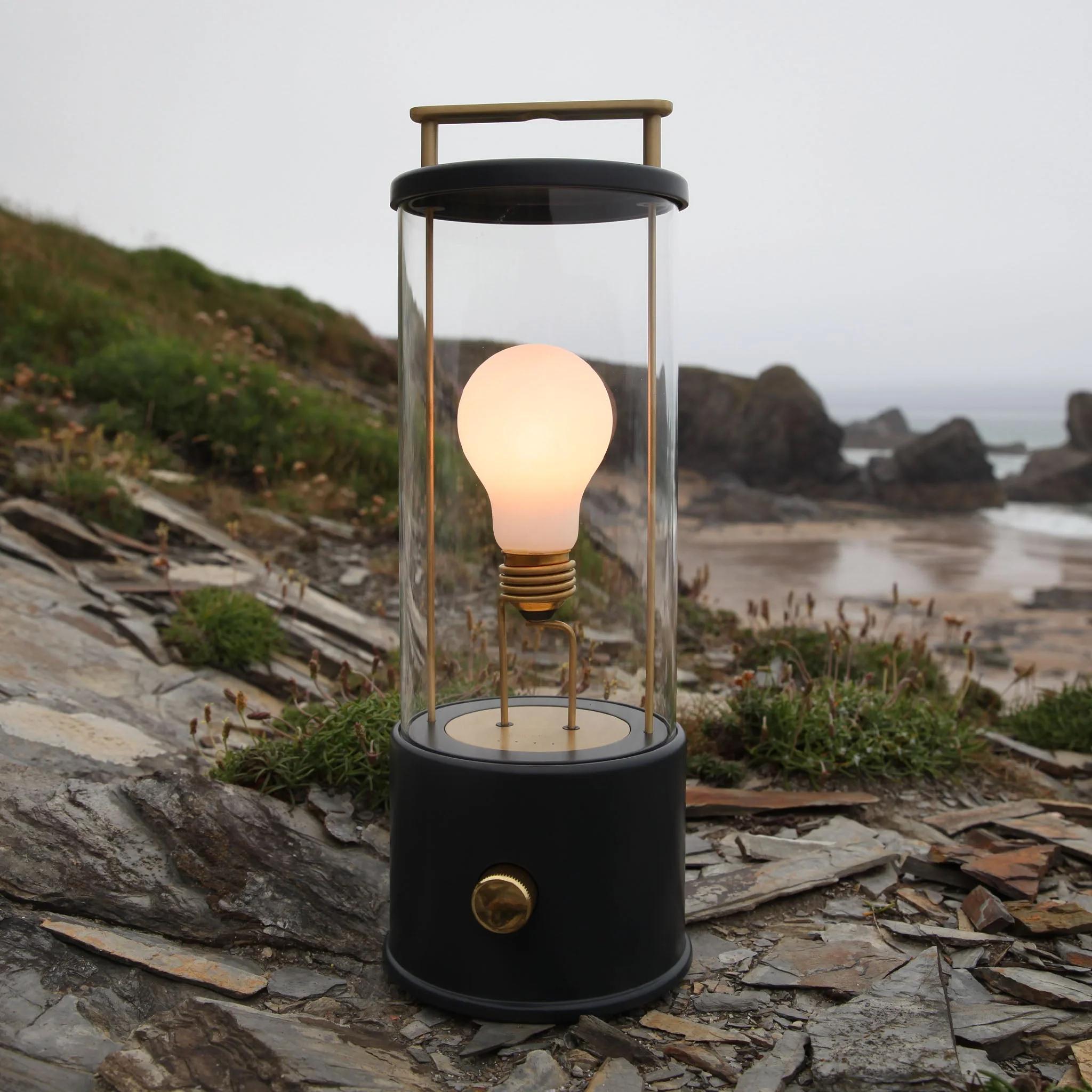 'The Muse' Portable Lamp by Farrow & Ball x Tala in Hackles Black.

Recalling the promise and grandeur of the British pleasure garden, The Muse mixes the classic lantern aesthetic with ultra-modern technology. Executed in brushed brass, custom