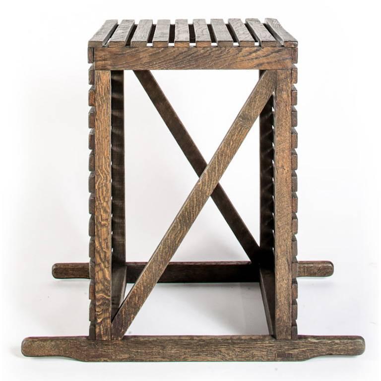 Rustic occasional or spot table in English oak, bench made in Great Britain. Based on the crates used for transporting museum pieces, the table has 