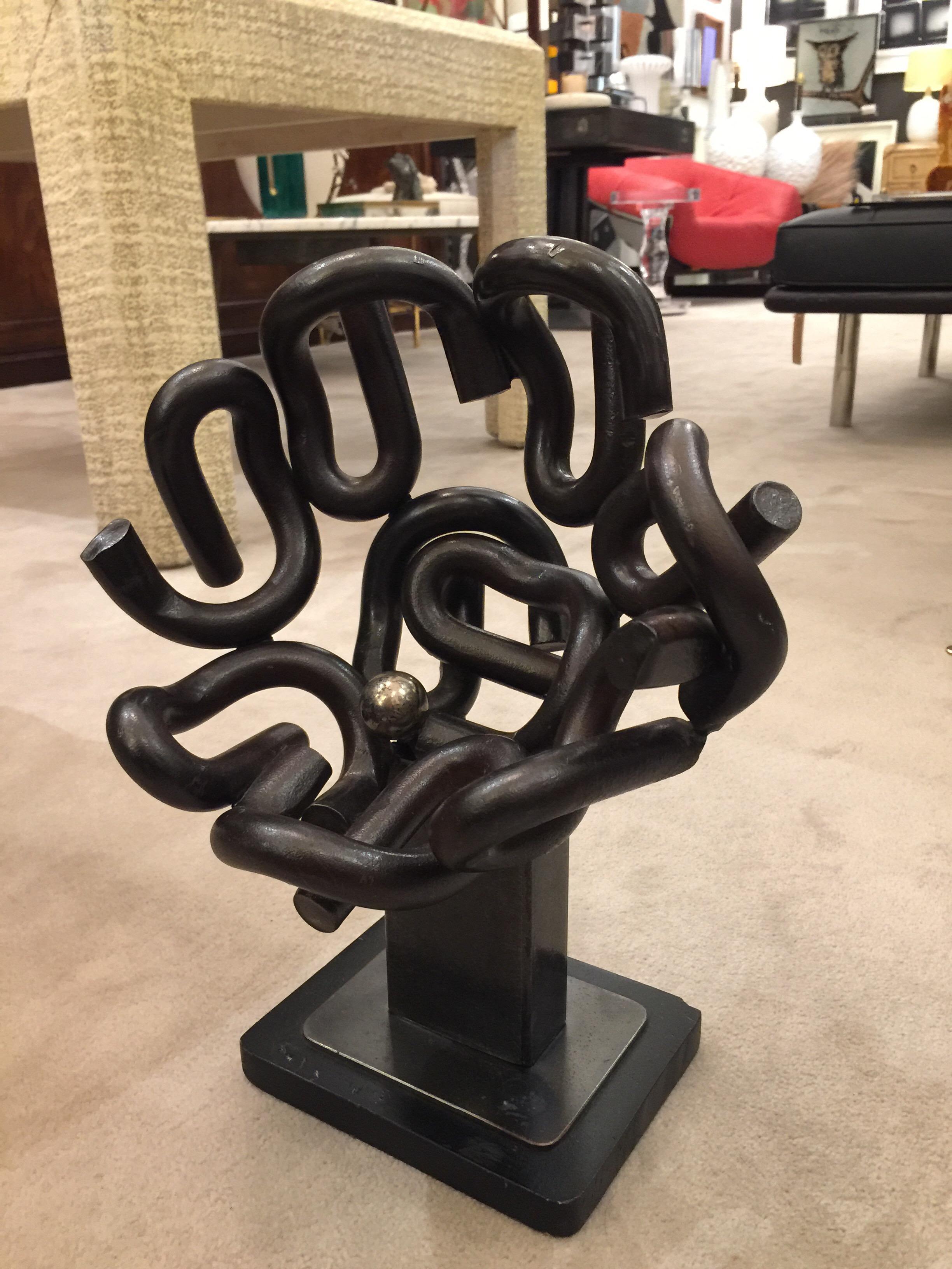 Beautiful and rare iron and brass sculpture in the shape of a large nest in the Postmodern style. Manufactured in the 1970s.
In perfect vintage condition Artist's mark is difficult to decipher. Powerful and yet organic.