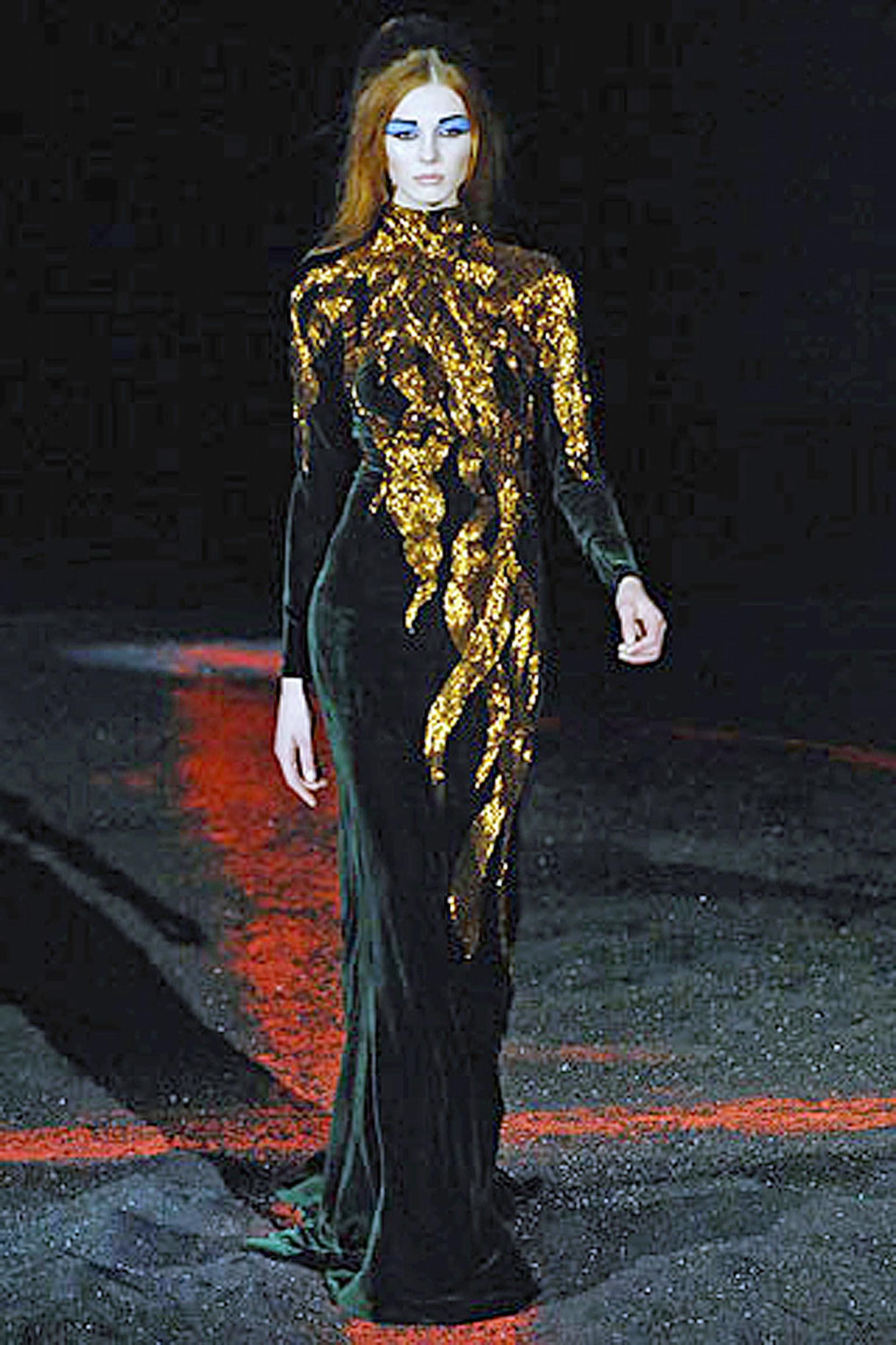 Highly coveted and now part of permanent museum collections is Alexander McQueen's 2007 sumptuous velvet flame gown.  This is the final one in my inventory offered brand new and unworn.

Fashioned of soft bias cut deep forest green panne silk velvet