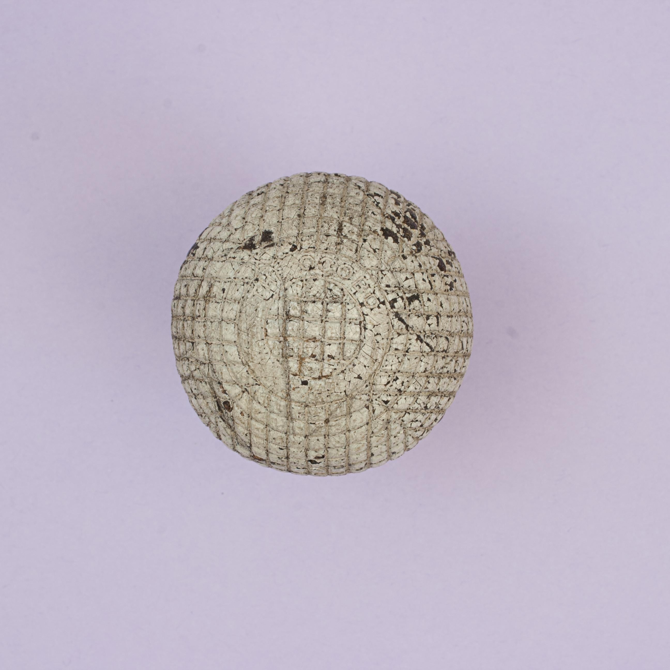Ocobo 27 ½, Antique Gutta Percha Golf Ball.
A good example of a moulded 'Ocobo' mesh patterned Victorian gutta percha golf ball manufactured by J.B. Halley & Co. Ltd. 76 Finsbury Pavement, London. The ball is marked 'The Ocobo 27½' on a raised