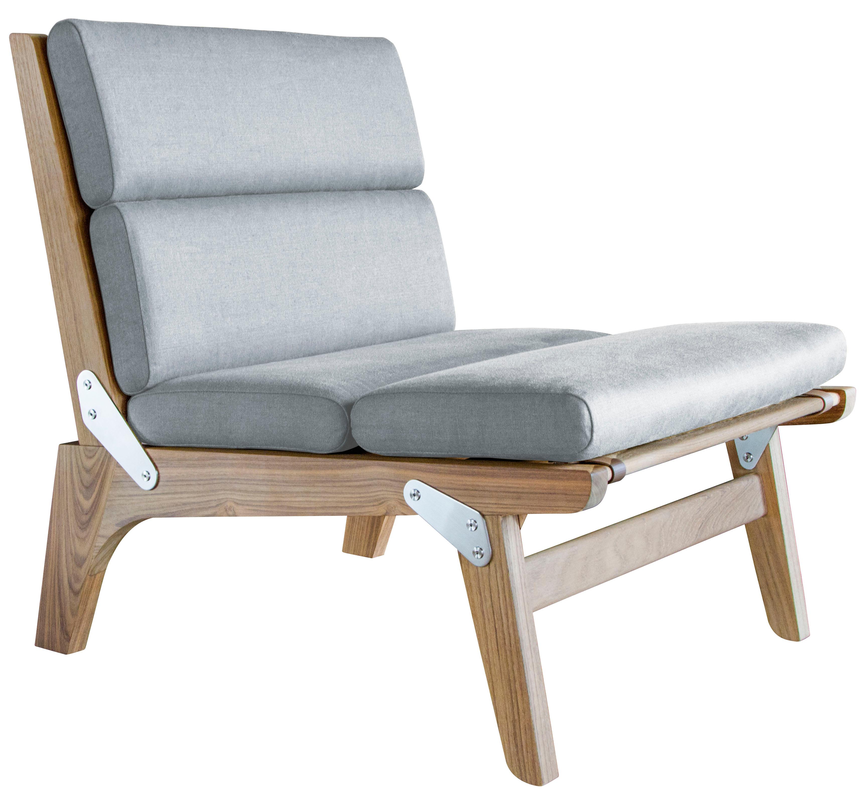 The Officer's Field Set folding lounge chair, shown in unfinished teak and Link outdoor fabric with faux leather straps. 
Also available non-folding and/or as an indoor chair.

The modern campaign collection by Richard Wrightman combines the